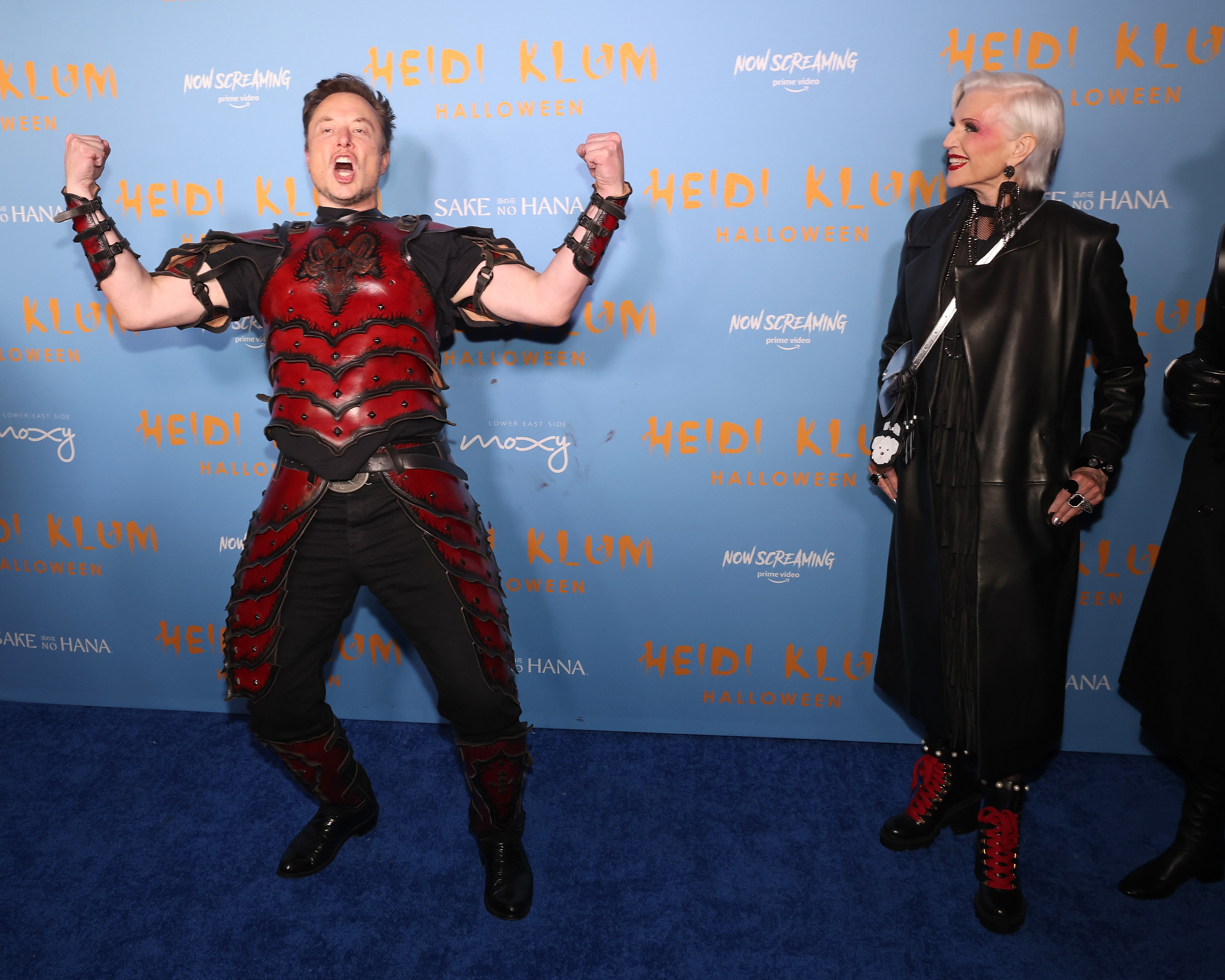 Elon Musk and his mom doing some uncanny shit in costume at Heidi Klum's Halloween party.