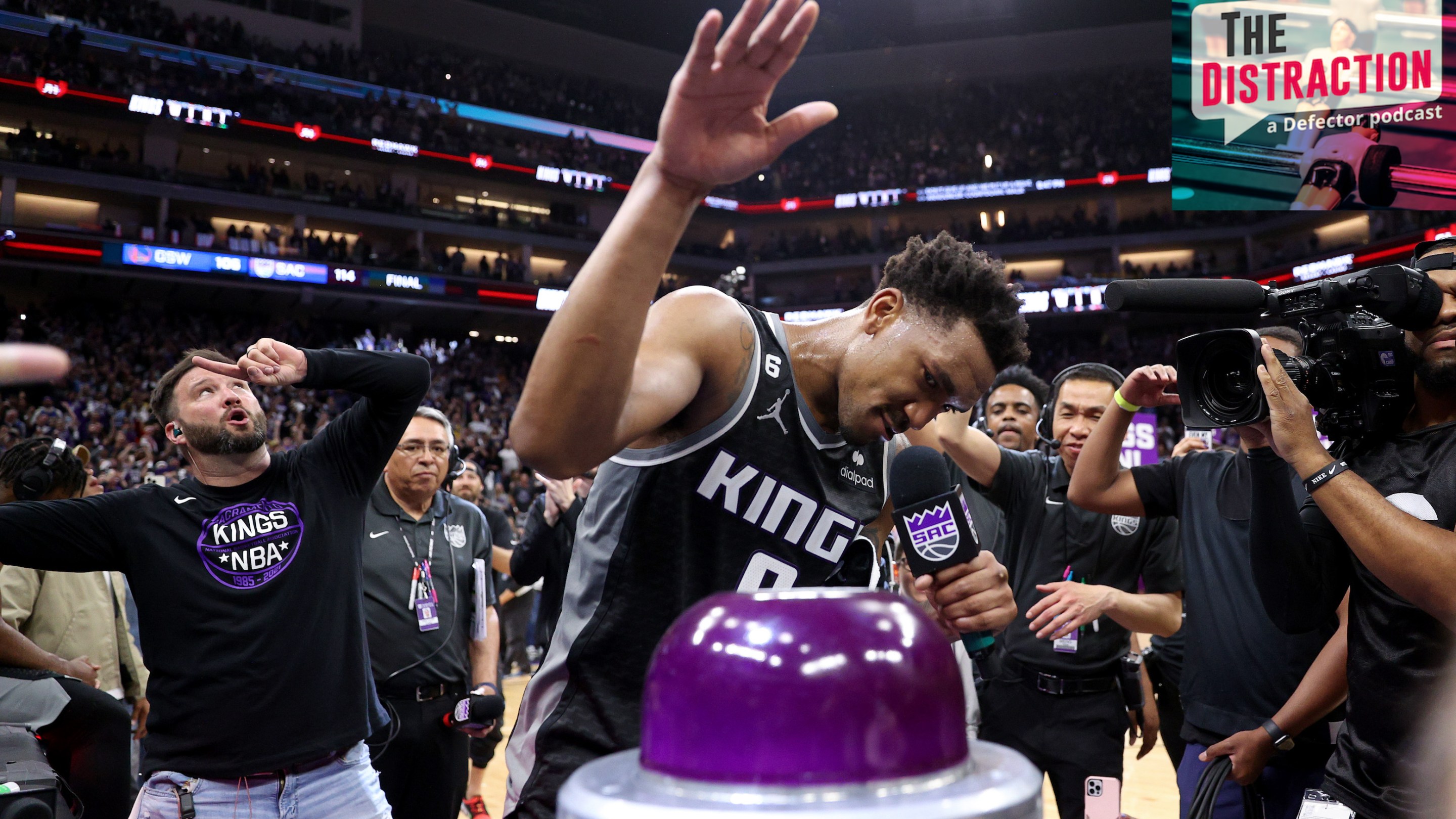 Malik Monk prepares to push the button that illuminates the beam after Sacramento's win against Golden State in Game 2 of their NBA Playoffs series.