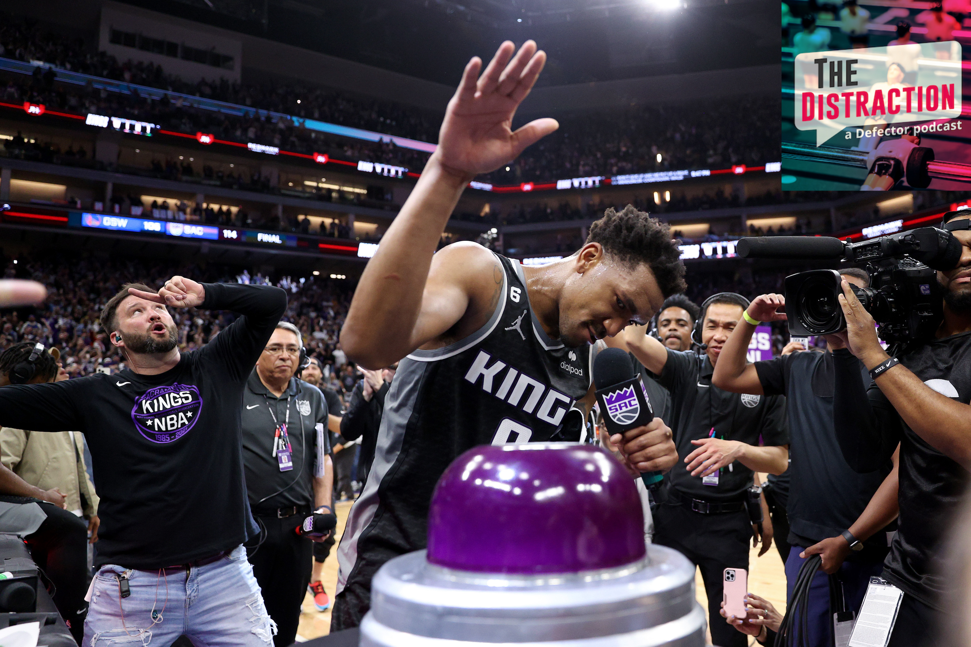 Malik Monk prepares to push the button that illuminates the beam after Sacramento's win against Golden State in Game 2 of their NBA Playoffs series.