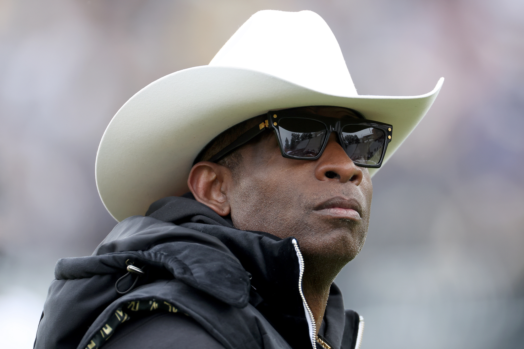 BOULDER, COLORADO - APRIL 22: Head coach Deion Sanders of the Colorado Buffaloes watches as his team warms up prior to their spring game at Folsom Field on April 22, 2023 in Boulder, Colorado. (Photo by Matthew Stockman/Getty Images)