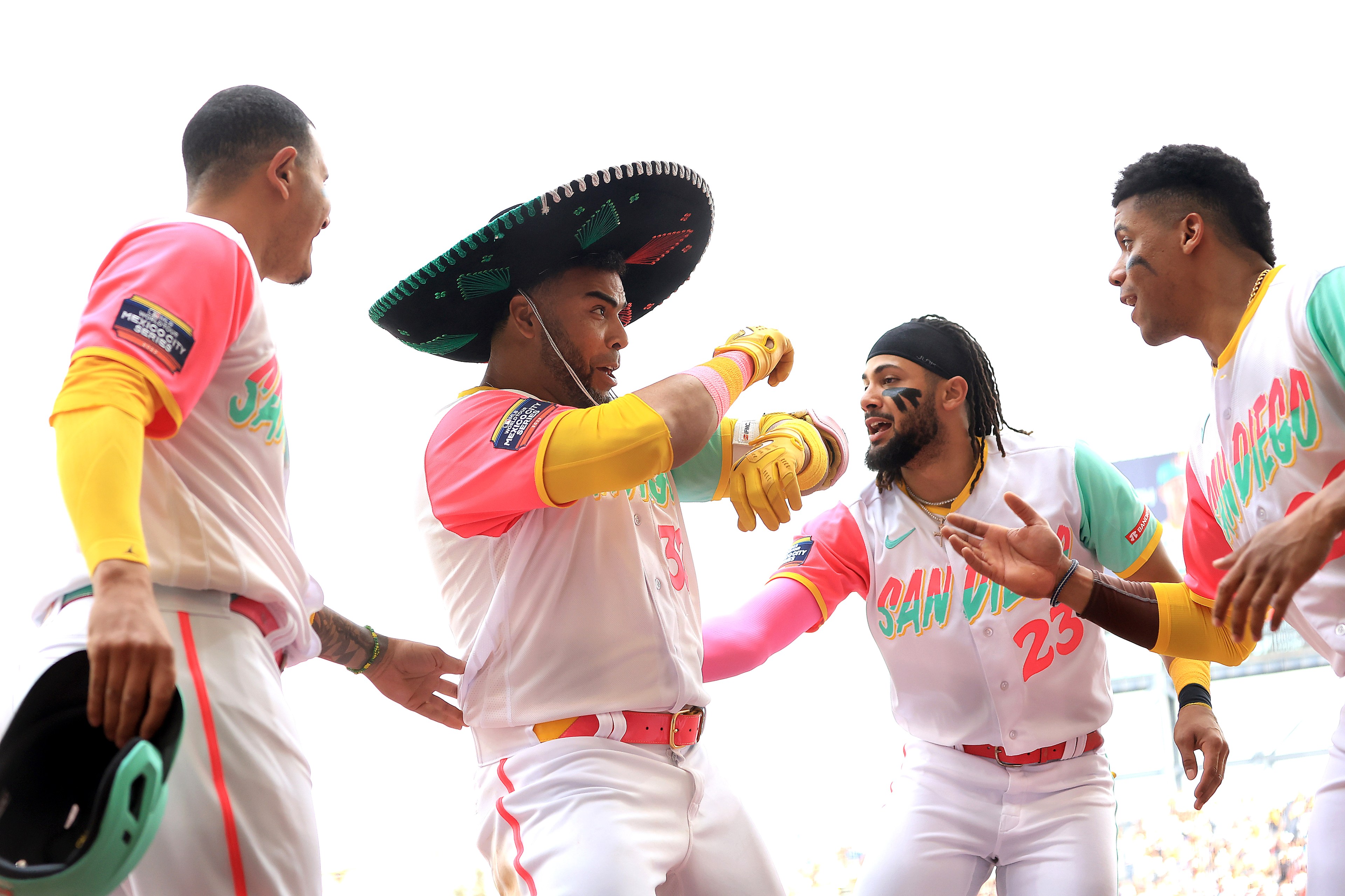Fernando Tatis Jr. #23, Manny Machado #13, and Juan Soto #22 congratulate Nelson Cruz #32 of the San Diego Padres after his solo homerun during the third inning of the MLB World Tour Mexico City Series against the San Francisco Giants at Alfredo Harp Helú Stadium on April 29, 2023 in Mexico City, Mexico.