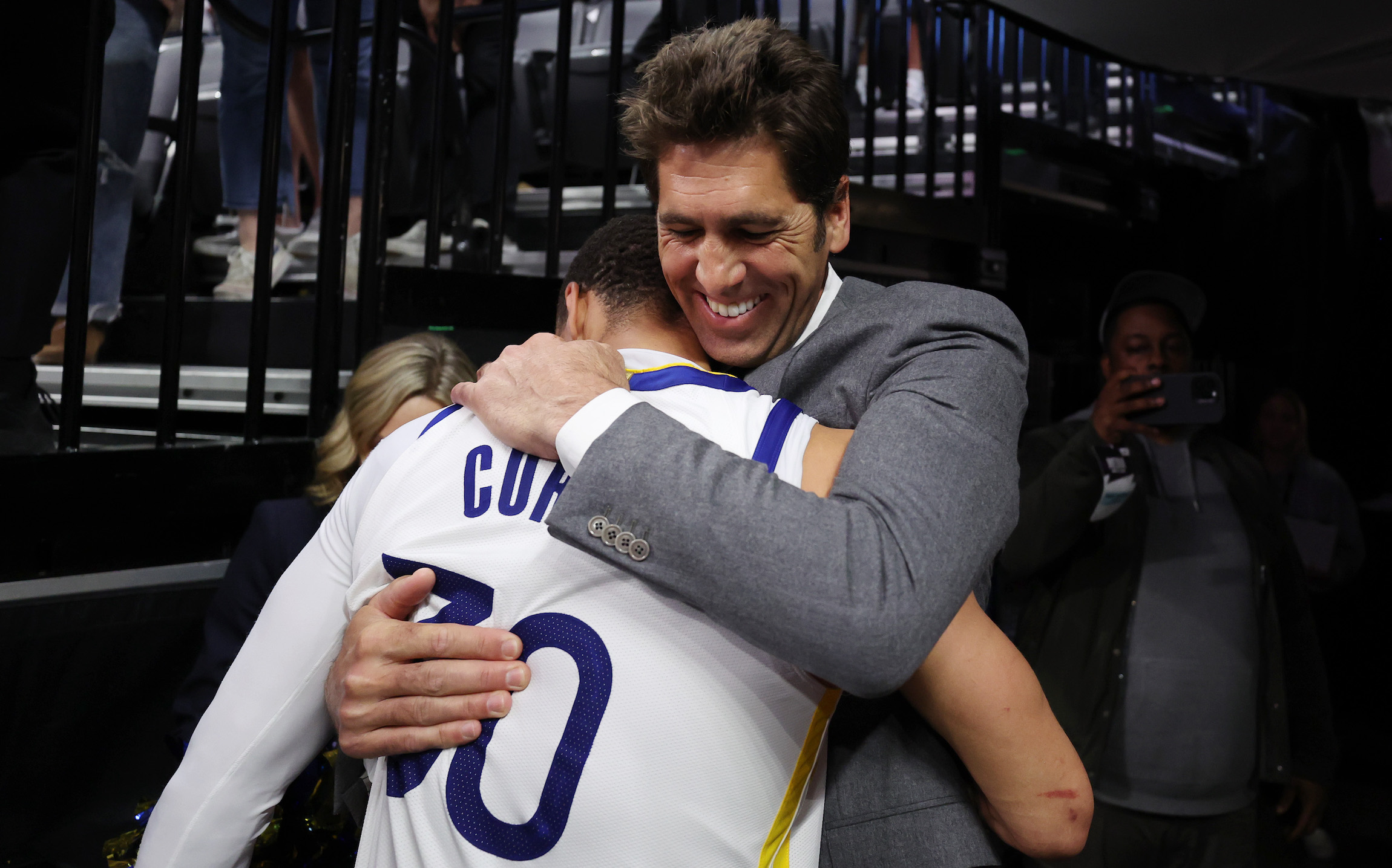 SACRAMENTO, CALIFORNIA - APRIL 30: Stephen Curry #30 of the Golden State Warriors hugs general manager Bob Myers after the Warriors defeated the Kings 120-100 in game seven of the Western Conference First Round Playoffs at Golden 1 Center on April 30, 2023 in Sacramento, California. NOTE TO USER: User expressly acknowledges and agrees that, by downloading and or using this photograph, User is consenting to the terms and conditions of the Getty Images License Agreement. (Photo by Ezra Shaw/Getty Images)
