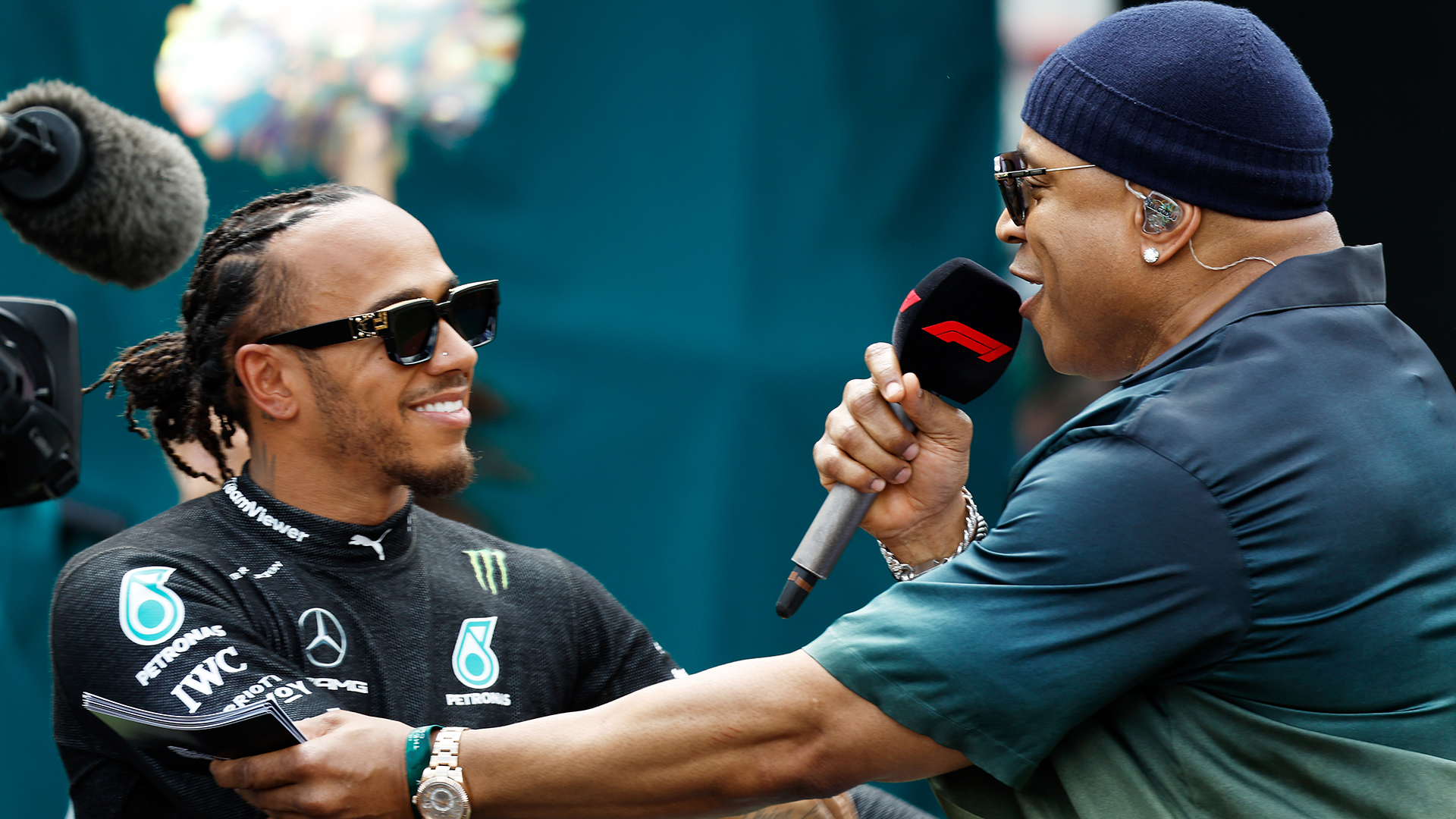 Lewis Hamilton of Great Britain and Mercedes hugs LL Cool J on the grid prior to the F1 Grand Prix of Miami at Miami International Autodrome on May 07, 2023 in Miami, Florida.
