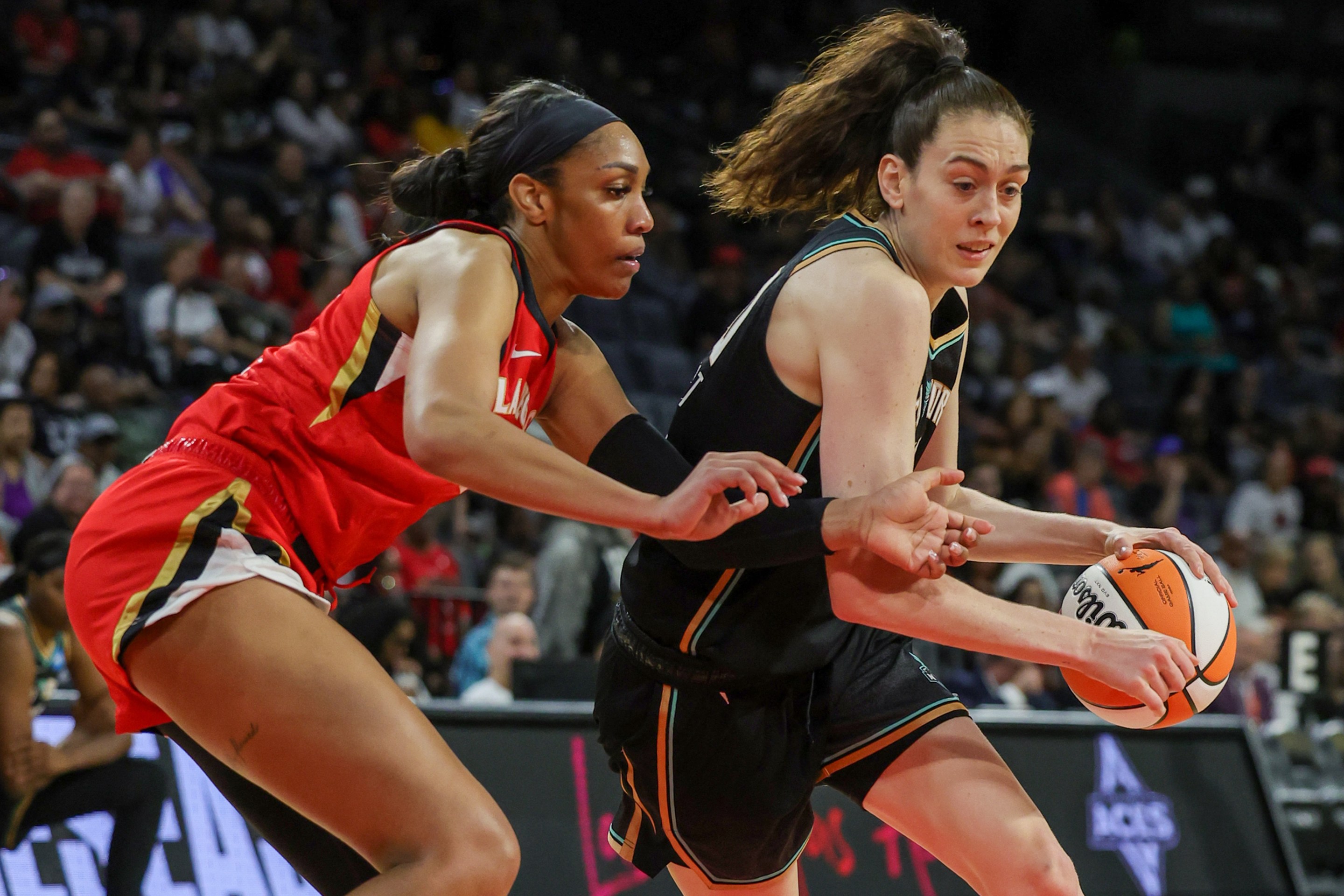 LAS VEGAS, NEVADA - MAY 13: Breanna Stewart #30 of the New York Liberty drives against A'ja Wilson #22 of the Las Vegas Aces in the second quarter of their preseason game at Michelob ULTRA Arena on May 13, 2023 in Las Vegas, Nevada. The Aces defeated the Liberty 84-77.