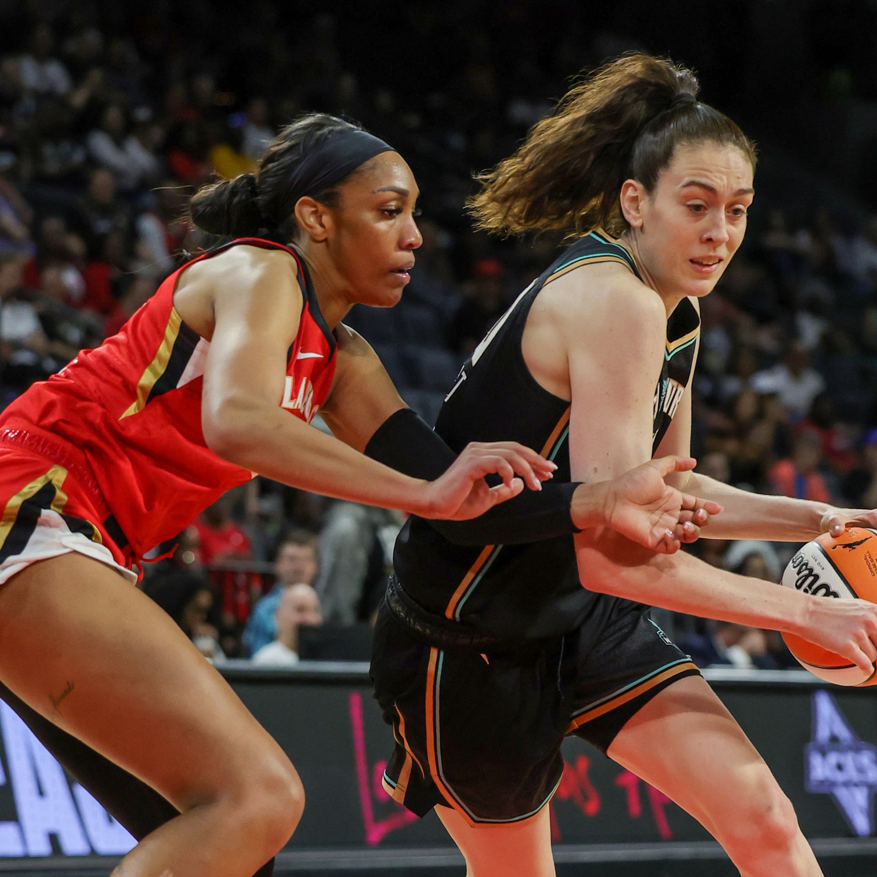 LAS VEGAS, NEVADA - MAY 13: Breanna Stewart #30 of the New York Liberty drives against A'ja Wilson #22 of the Las Vegas Aces in the second quarter of their preseason game at Michelob ULTRA Arena on May 13, 2023 in Las Vegas, Nevada. The Aces defeated the Liberty 84-77.