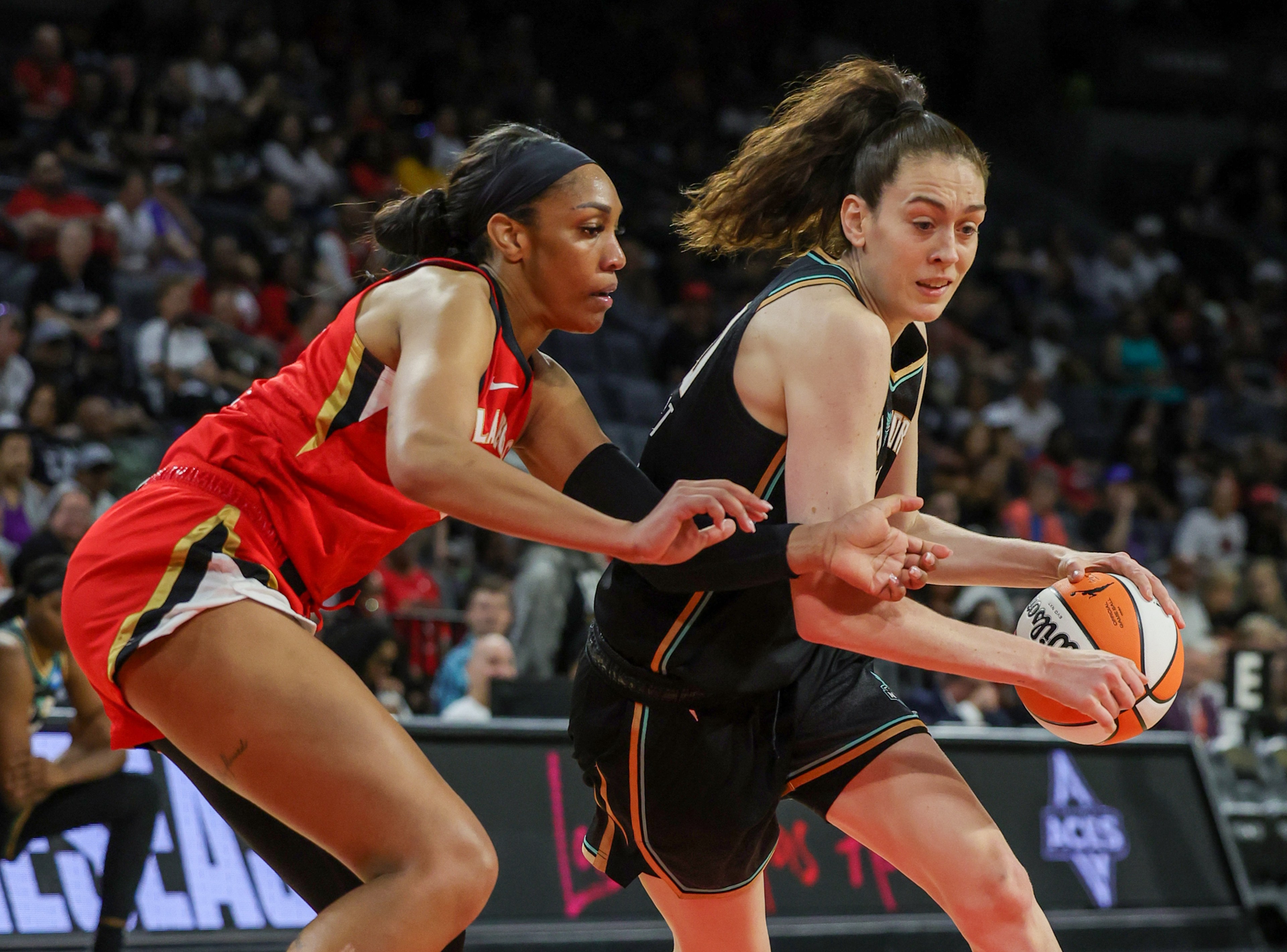 LAS VEGAS, NEVADA - MAY 13: Breanna Stewart #30 of the New York Liberty drives against A'ja Wilson #22 of the Las Vegas Aces in the second quarter of their preseason game at Michelob ULTRA Arena on May 13, 2023 in Las Vegas, Nevada. The Aces defeated the Liberty 84-77.