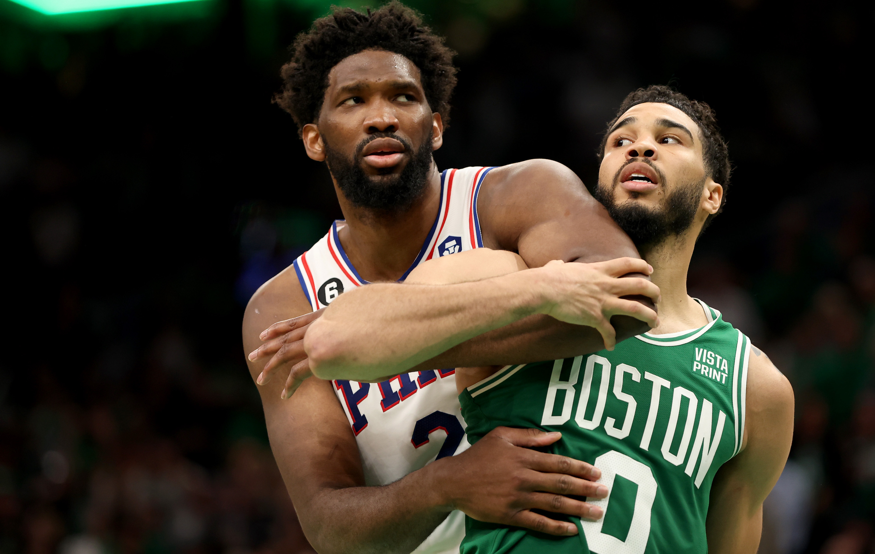 BOSTON, MASSACHUSETTS - MAY 14: Jayson Tatum #0 of the Boston Celtics collides with Joel Embiid #21 of the Philadelphia 76ers during the fourth quarter in game seven of the 2023 NBA Playoffs Eastern Conference Semifinals at TD Garden on May 14, 2023 in Boston, Massachusetts. NOTE TO USER: User expressly acknowledges and agrees that, by downloading and or using this photograph, User is consenting to the terms and conditions of the Getty Images License Agreement. (Photo by Adam Glanzman/Getty Images)