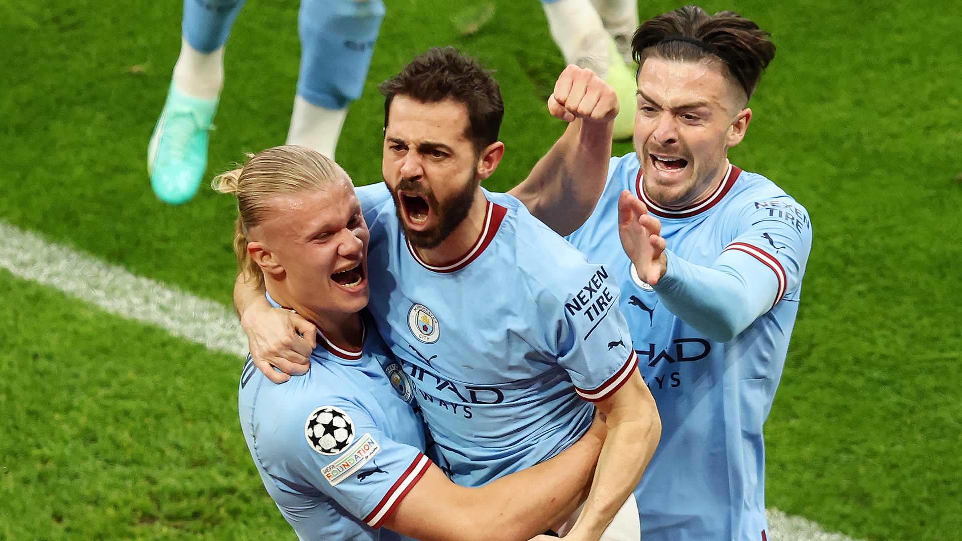 Bernardo Silva of Manchester City celebrates with teammates Erling Haaland and Jack Grealish after scoring the teams second goal during the UEFA Champions League semi-final second leg match between Manchester City FC and Real Madrid at Etihad Stadium on May 17, 2023 in Manchester, England.