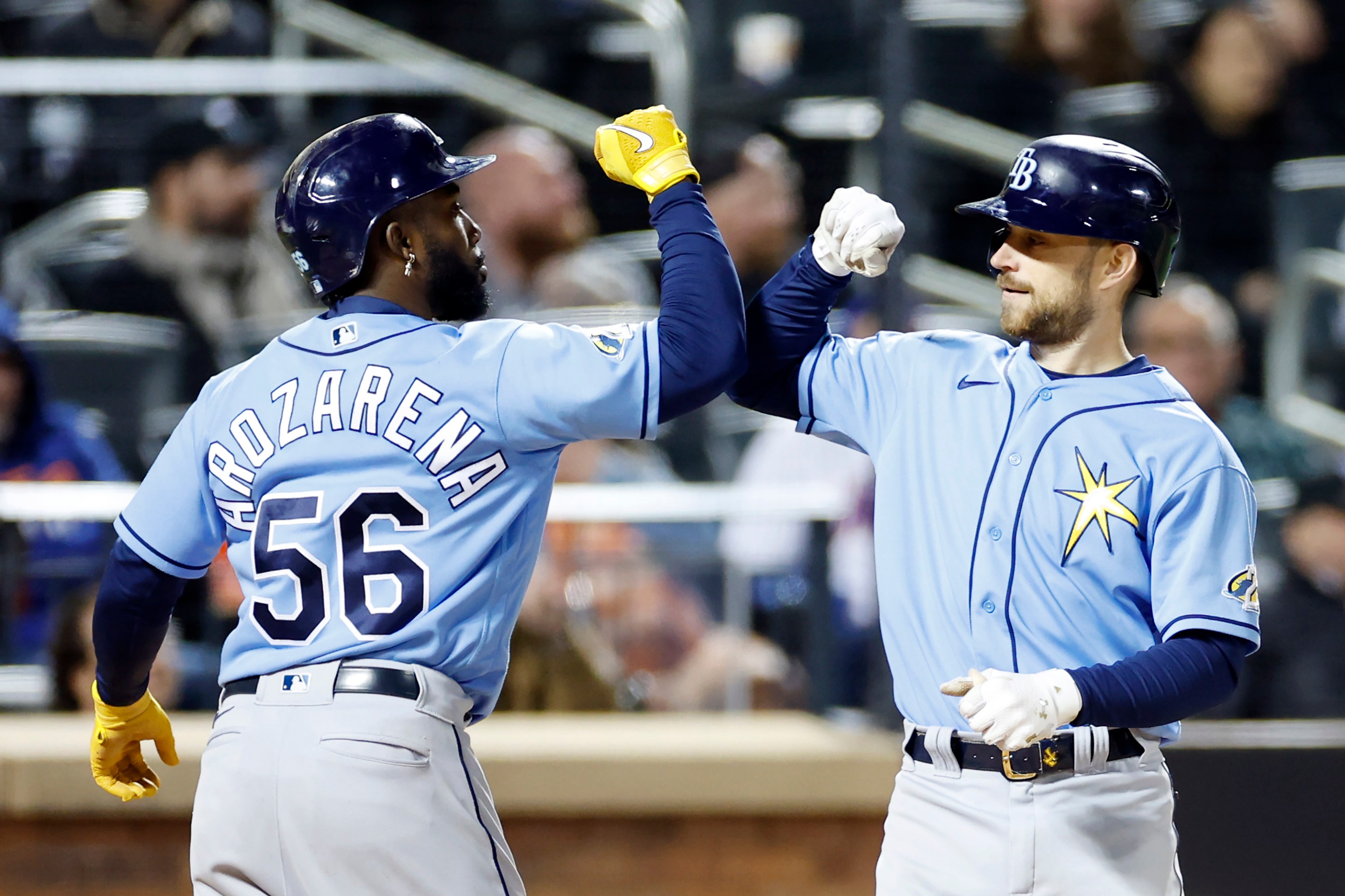 Tampa Bay Rays Randy Arozarena and Brandon Lowe celebrate Lowe's two-run homer in a May game.