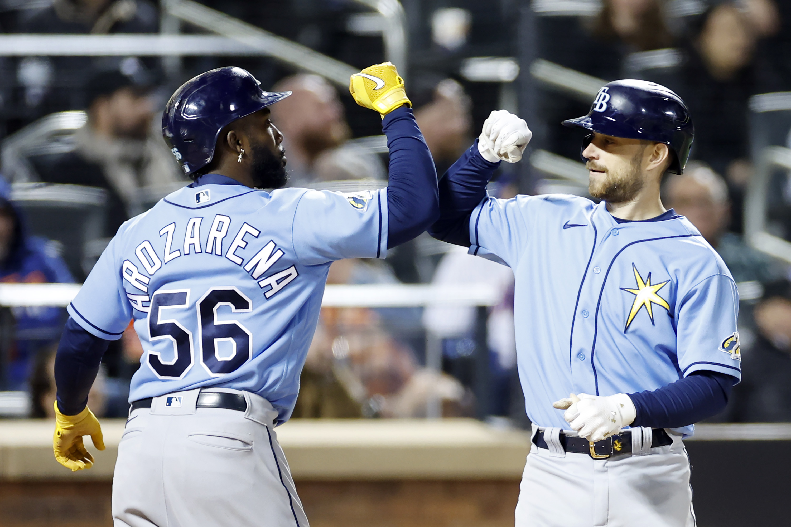 Tampa Bay Rays Randy Arozarena and Brandon Lowe celebrate Lowe's two-run homer in a May game.