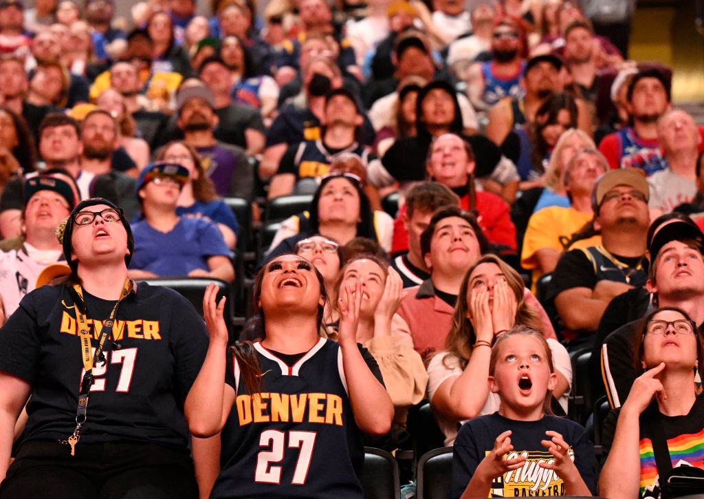 DENVER, COLORADO - MAY 22: Fans watch the big screens at Ball Arena show the Denver Nuggets playing in Game 4 of the Western Conference Finals on May 22, 2023 in Denver, Colorado. Denver Nuggets are playing Los Angeles Lakers in Los Angeles. If the Nuggets win they will clinch a spot in the NBA Finals for the first time in franchise history.