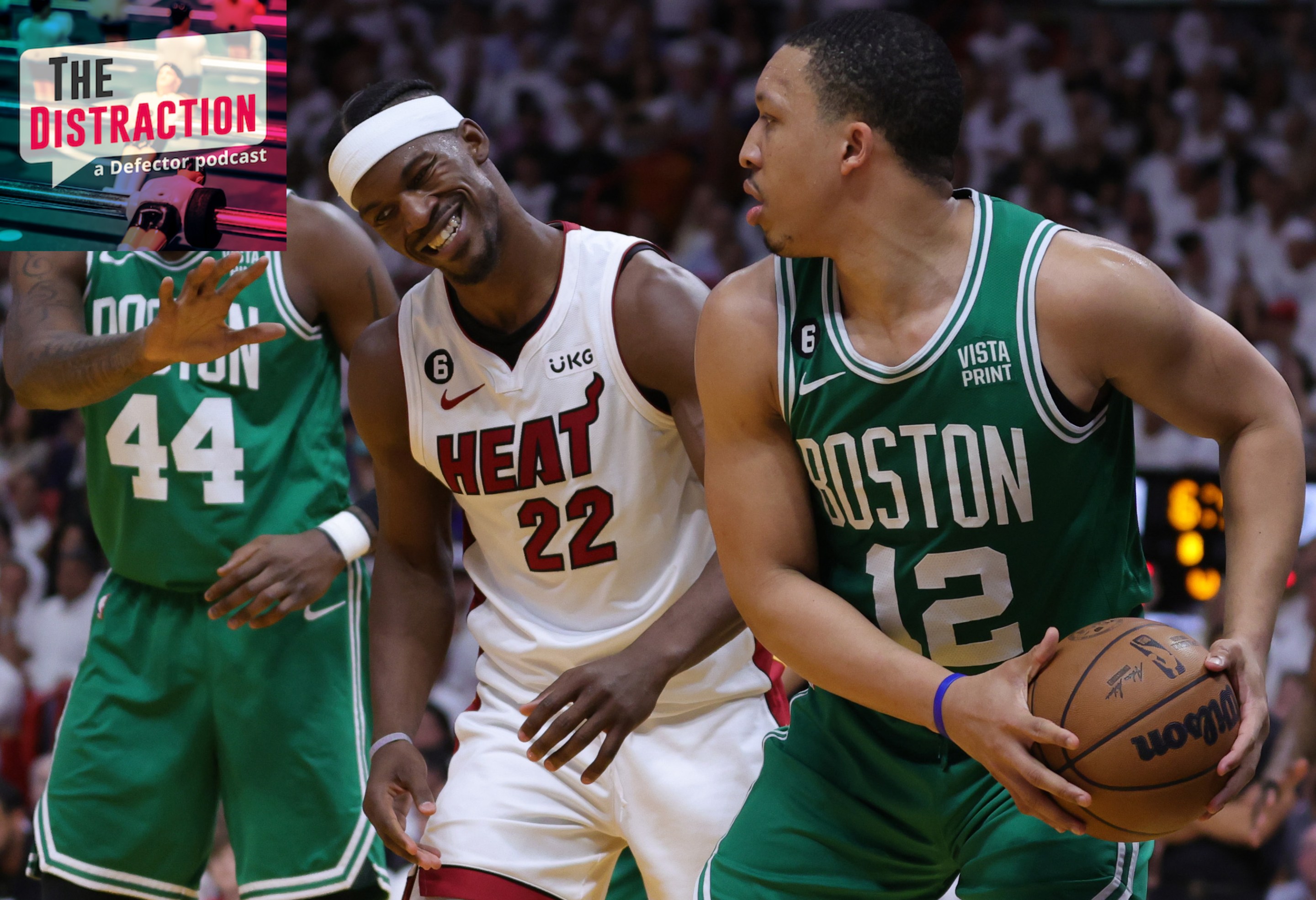 Grant Williams of the Boston Celtics holds the ball while Jimmy Butler makes a Jimmy Butler Face in an Eastern Conference Finals game..