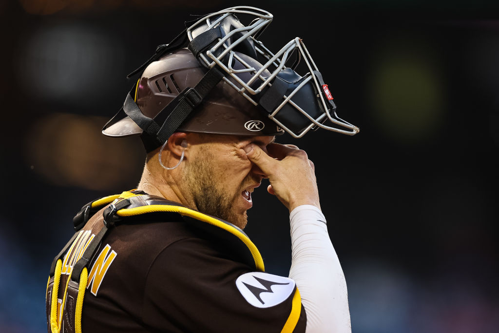 Brett Sullivan of the Padres rubbing his eyes