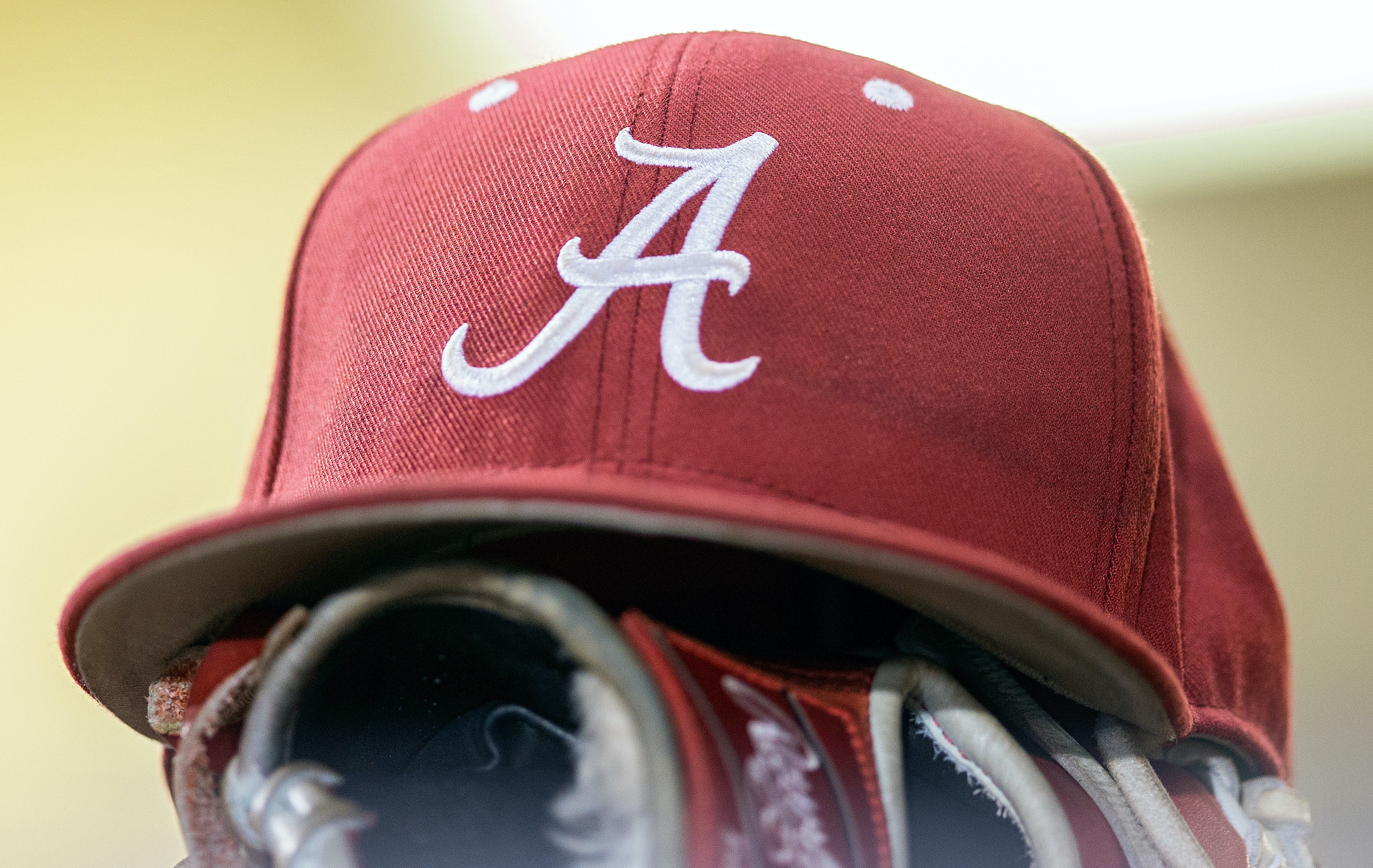 An Alabama Crimson Tide hat rests in the dugout during a game between the Alabama Crimson Tide and the LSU Tigers on May 12, 2018, at Alex Box Stadium in Baton Rouge, LA.