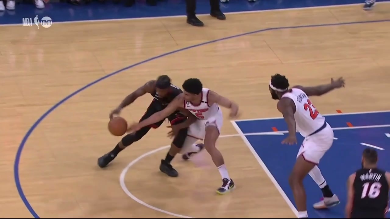 Quentin Grimes steals the ball from Jimmy Butler