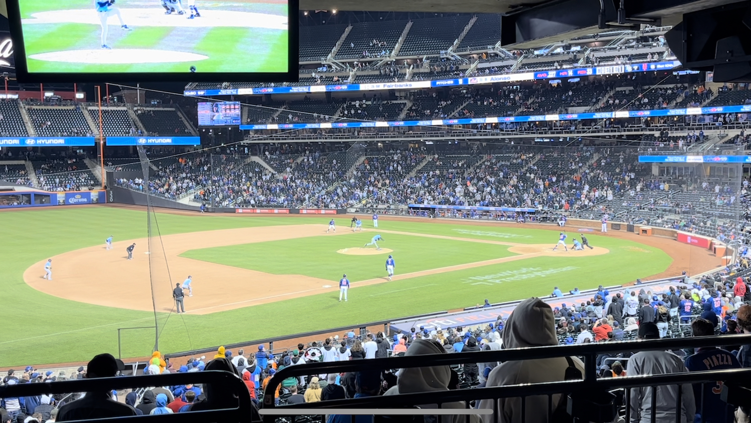 A view of the Mets game from the concourse. Pete Alonso is about to hit a walk-off home run.