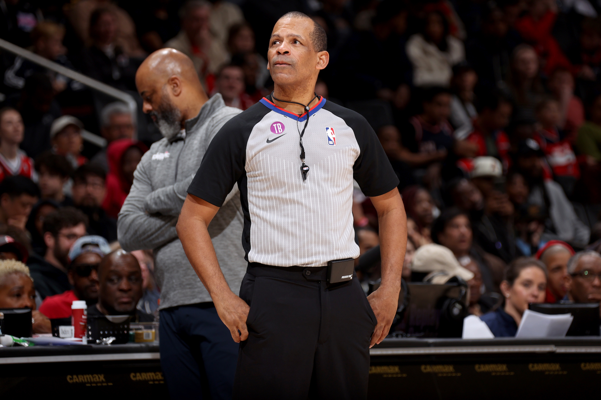 NBA ref Eric Lewis stands