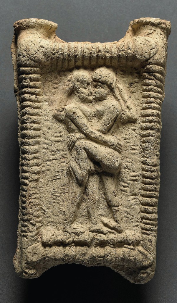A clay model from Mesopotamia that dates back to 1800 BCE, depicting a nude couple kissing and copulating.