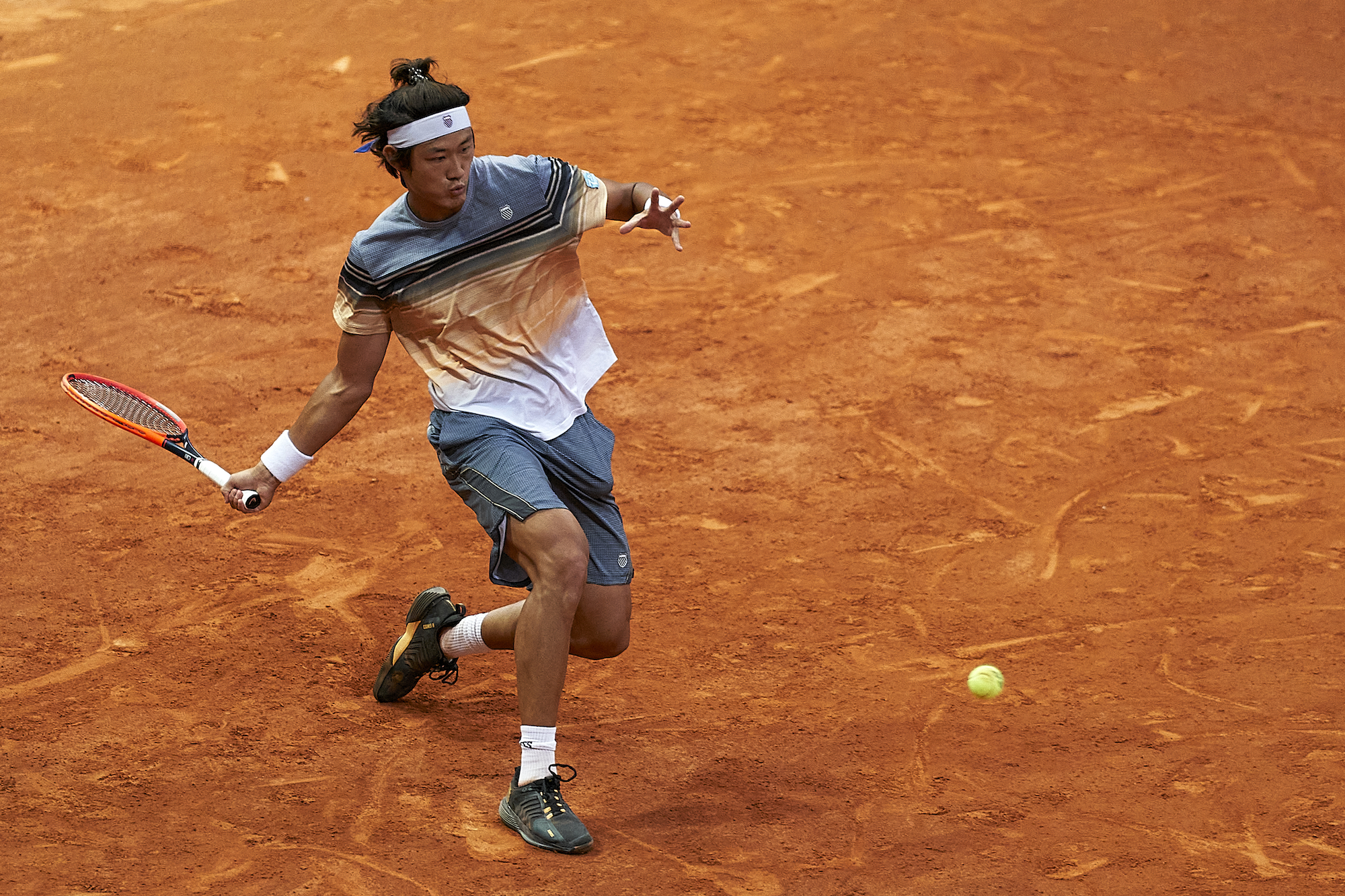 Zhizhen Zhang hits a ball