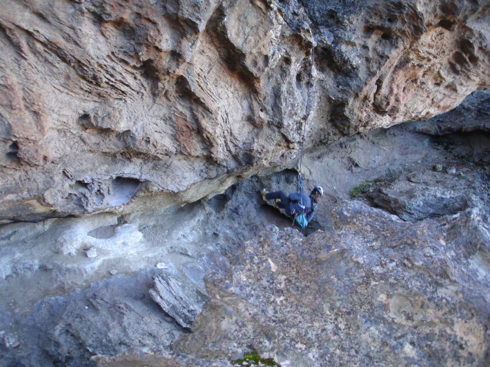 Researcher descending to the off-season nest site.