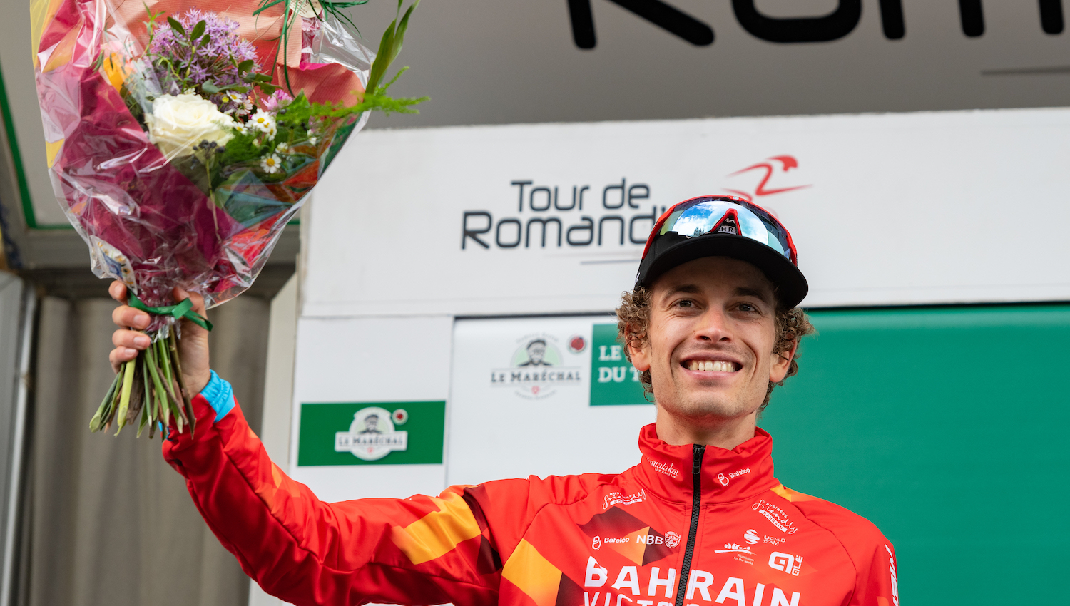 VILLARS-SUR-OLLON, SWITZERLAND - MAY 01: Gino Mader of Switzerland and Team Bahrain Victorious celebrates the second place on the podium after the 75th Tour De Romandie 2022 - Stage 5 on May 1, 2022 in Villars-sur-Ollon, Switzerland. (Photo by RvS.Media/Basile Barbey/Getty Images,)
