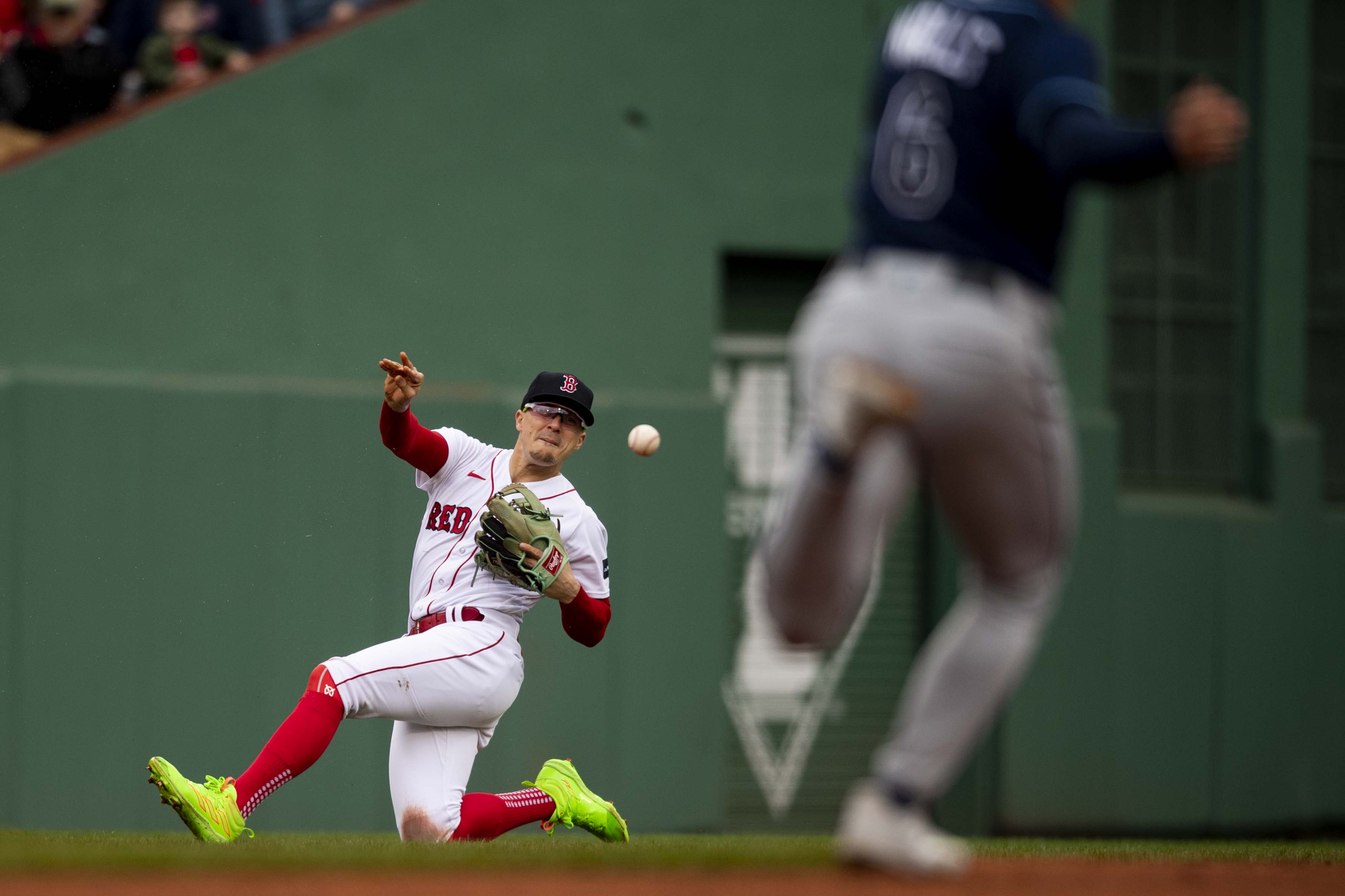 Enrique Hernandez #5 of the Boston Red Sox makes an error as he throws to second base during the second inning of a game against the Tampa Bay Rays on June 3, 2023 at Fenway Park in Boston, Massachusetts.