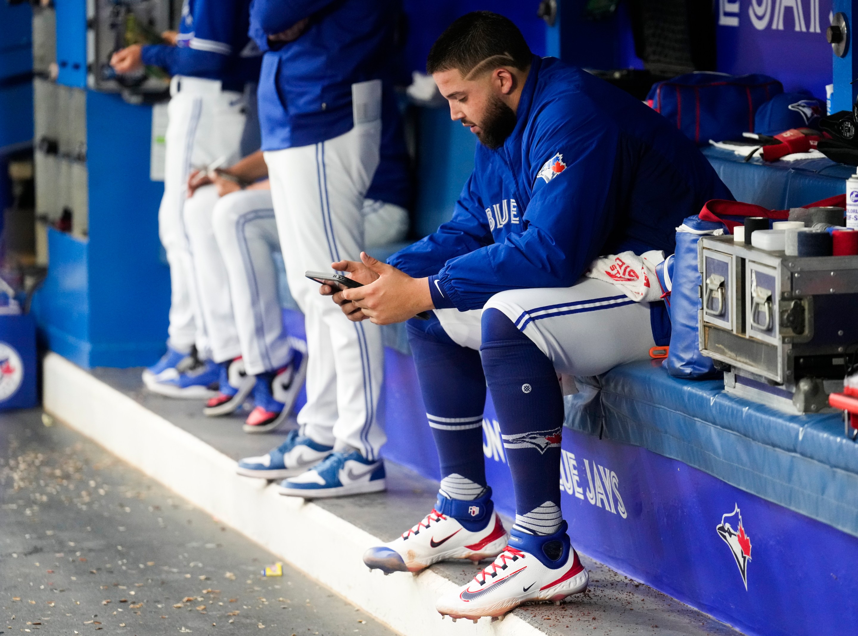 Alek Manoah #6 of the Toronto Blue Jays watches recording on the iPad in the dugout after getting pulled from the game in the first inning against the Houston Astros in their MLB game at the Rogers Centre on June 5, 2023 in Toronto, Ontario, Canada.