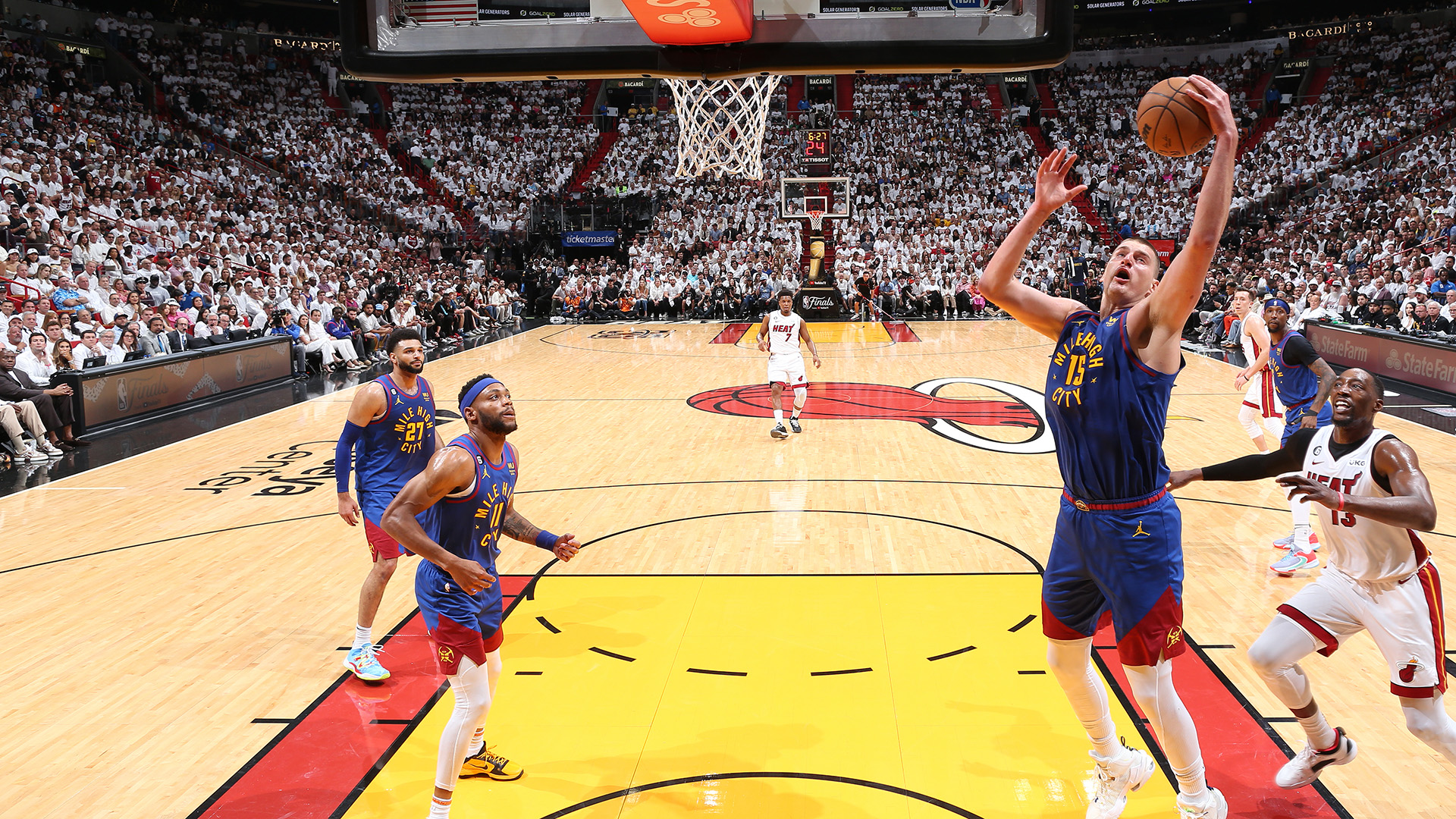 Nikola Jokic #15 of the Denver Nuggets grabs the rebound during Game Three of the 2023 NBA Finals against the Miami Heat on June 7, 2023 at Kaseya Center in Miami, Florida.