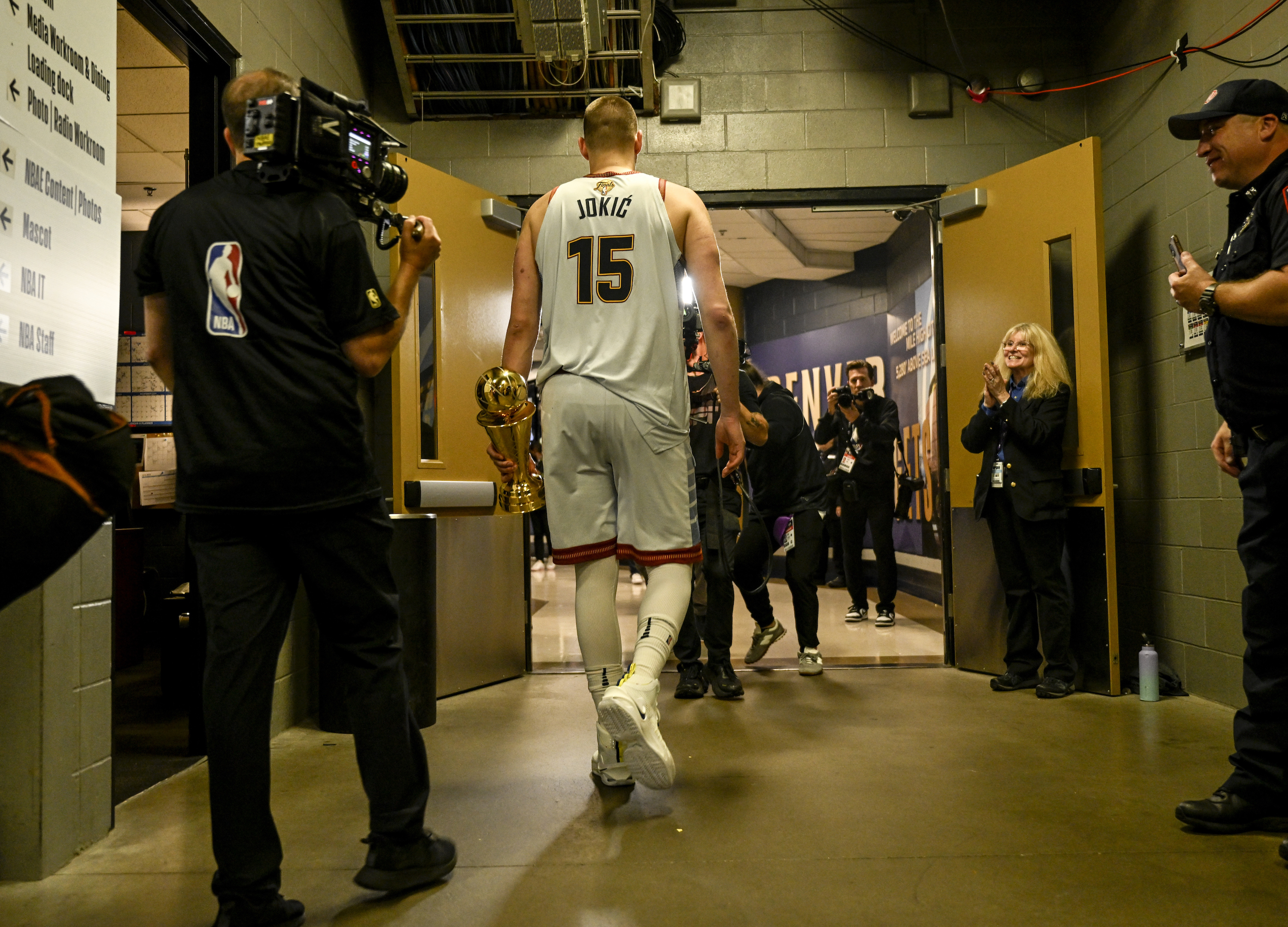 Nikola Jokic (15) of the Denver Nuggets celebrates as he leaves the court after the fourth quarter of the Nuggets' 94-89 NBA Finals clinching win at Ball Arena in Denver on Monday, June 12, 2023.