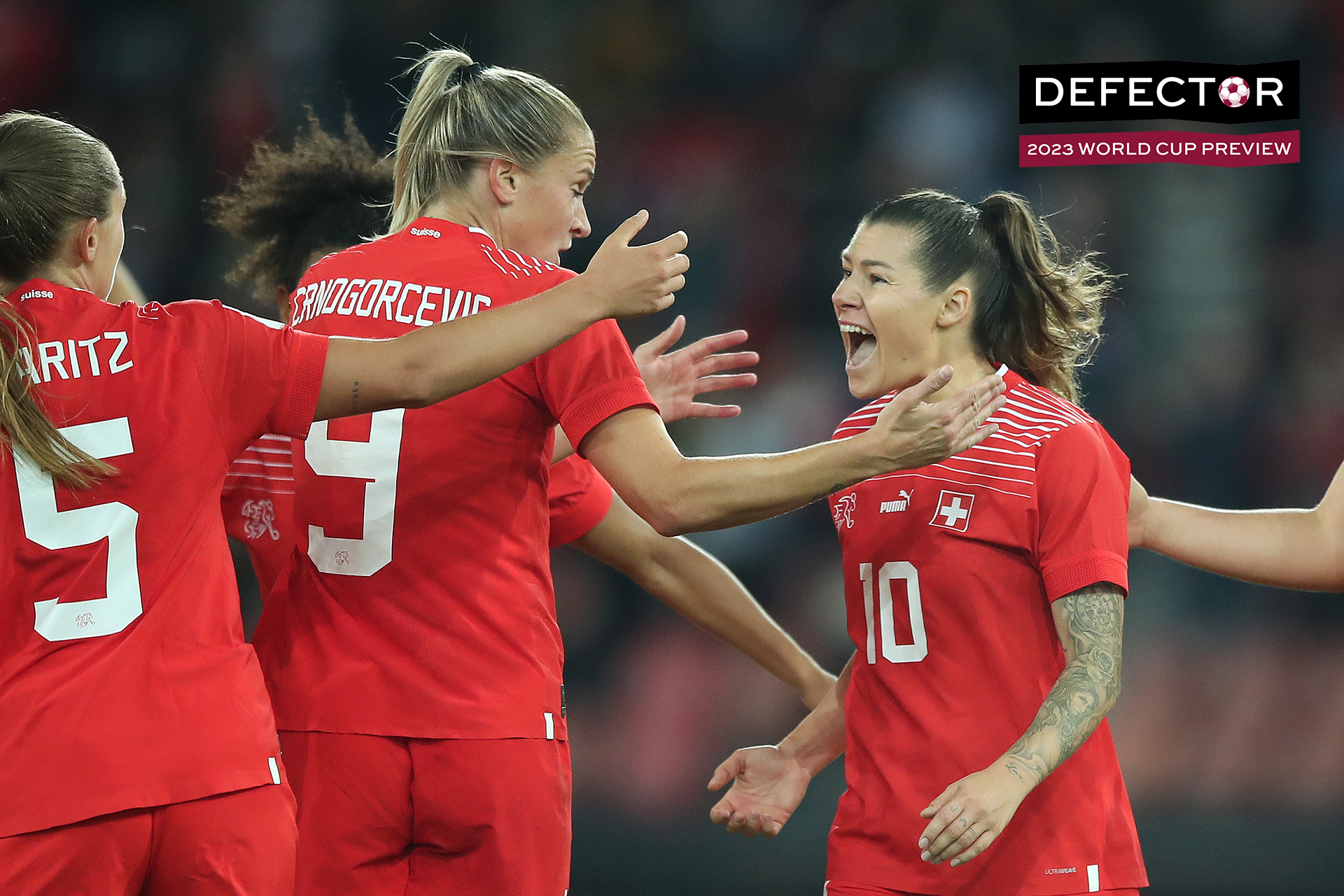 Ramona Bachmann of Switzerland celebrates scoring their side's first goal with teammates Noelle Maritz and Ana-Maria Crnogorcevic during the 2023 FIFA Women's World Cup play-off round 2 match between Switzerland and Wales at Stadion Letzigrund on October 11, 2022 in Zurich, Zurich