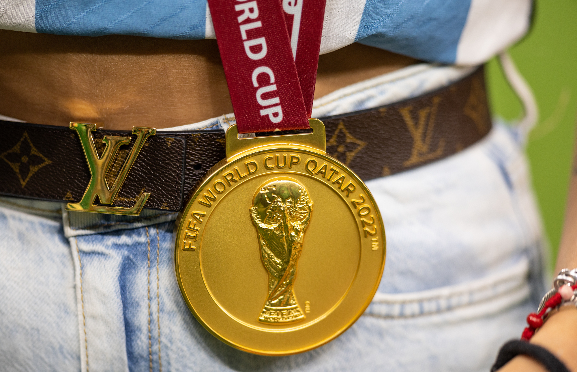 A closeup of the Qatar World Cup gold medal