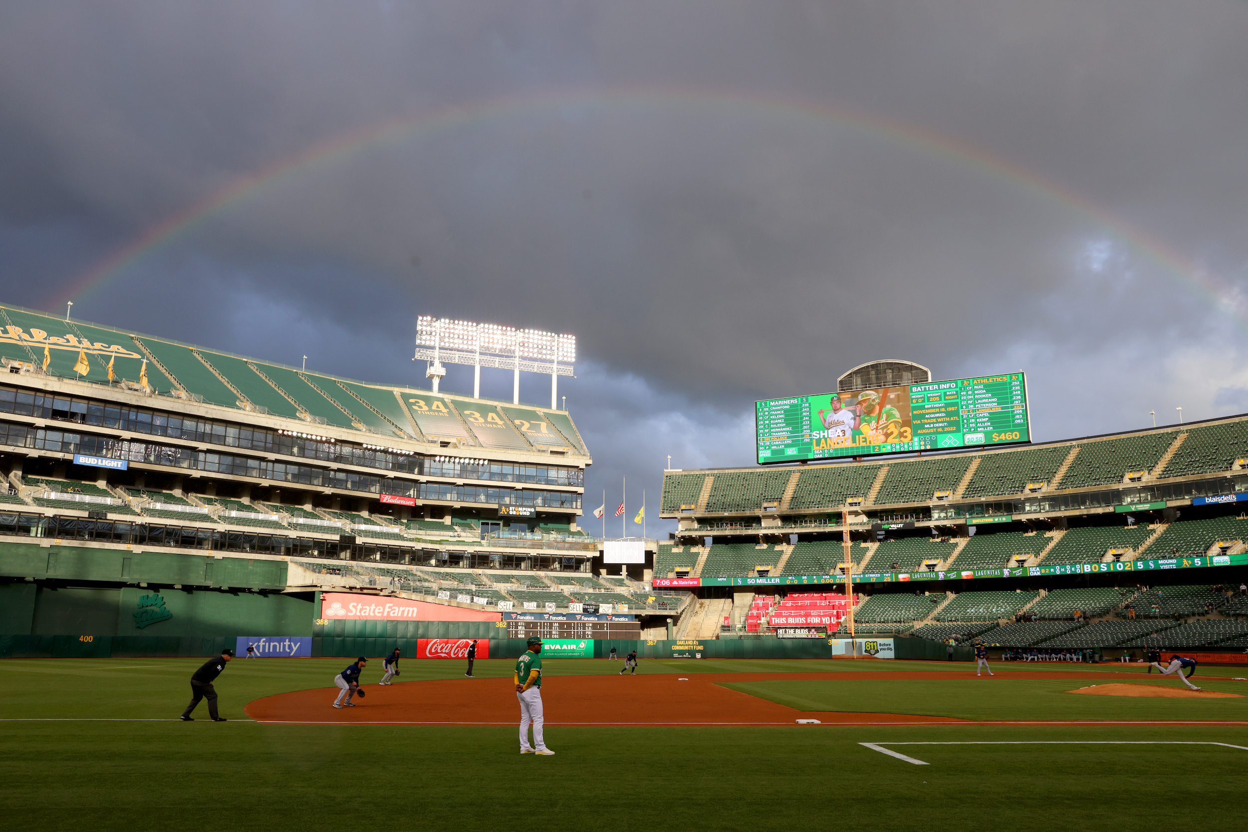 A rainbow over a mostly empty Oakland Coliseum.