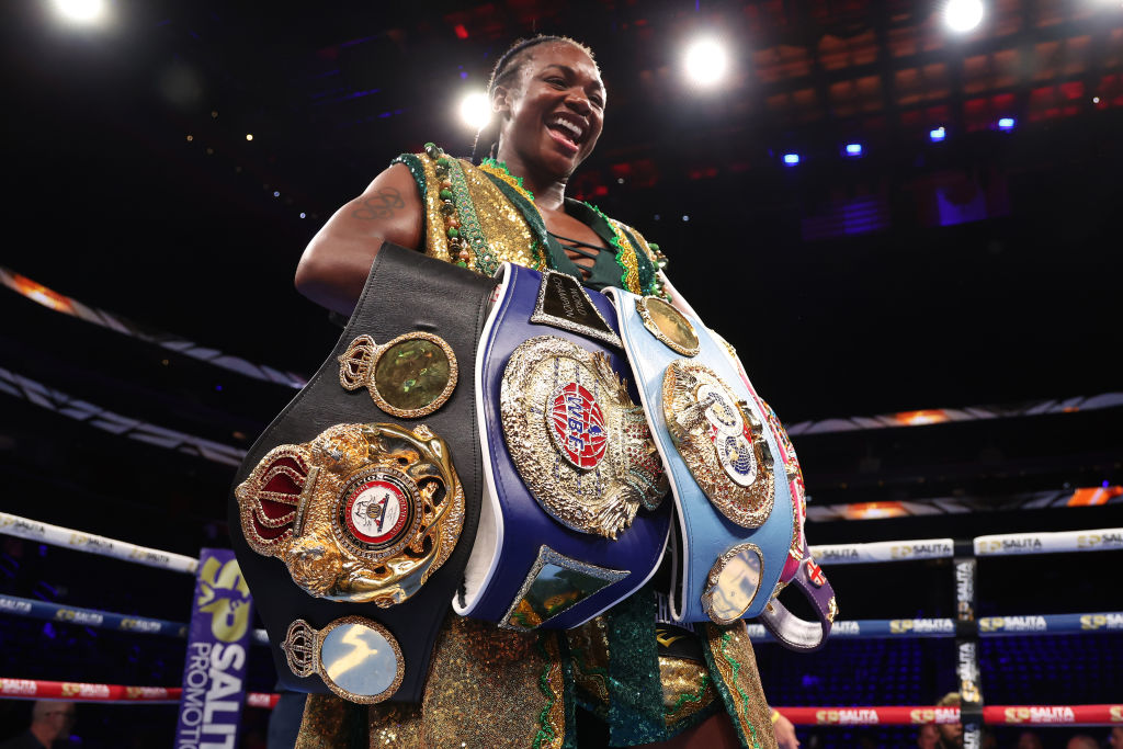 Claressa Shields poses with her belts