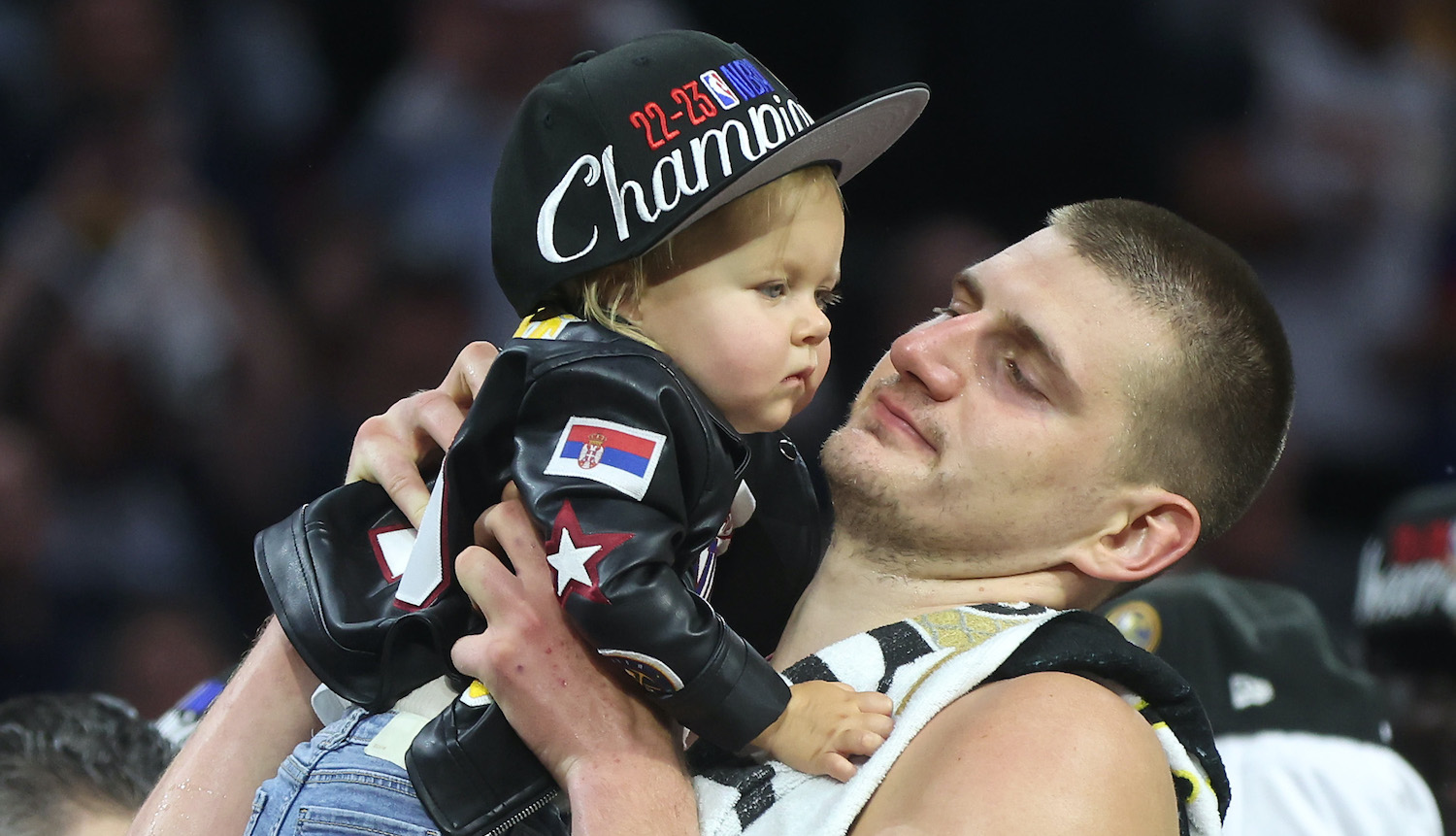 DENVER, COLORADO - JUNE 12: (EDITORS NOTE: Retransmission with alternate crop.) Nikola Jokic #15 of the Denver Nuggets celebrates with his daughter Ognjena after a 94-89 victory against the Miami Heat in Game Five of the 2023 NBA Finals to win the NBA Championship at Ball Arena on June 12, 2023 in Denver, Colorado. NOTE TO USER: User expressly acknowledges and agrees that, by downloading and or using this photograph, User is consenting to the terms and conditions of the Getty Images License Agreement. (Photo by Matthew Stockman/Getty Images)