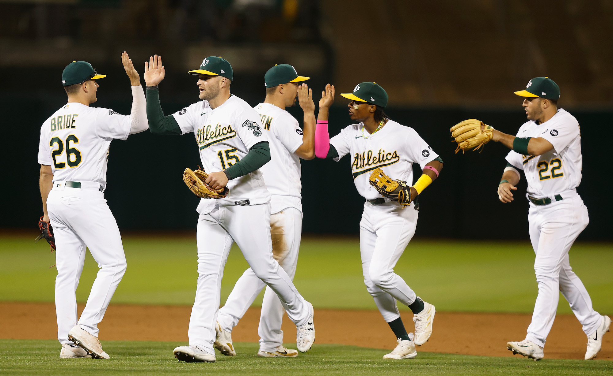 OAKLAND, CALIFORNIA - JUNE 12: Jonah Bride #26, Seth Brown #15, Jace Peterson #6, Esteury Ruiz #1 and Ramon Laureano #22 of the Oakland Athletics celebrate after a 4-3 win against the Tampa Bay Rays at RingCentral Coliseum on June 12, 2023 in Oakland, California. (Photo by Lachlan Cunningham/Getty Images)