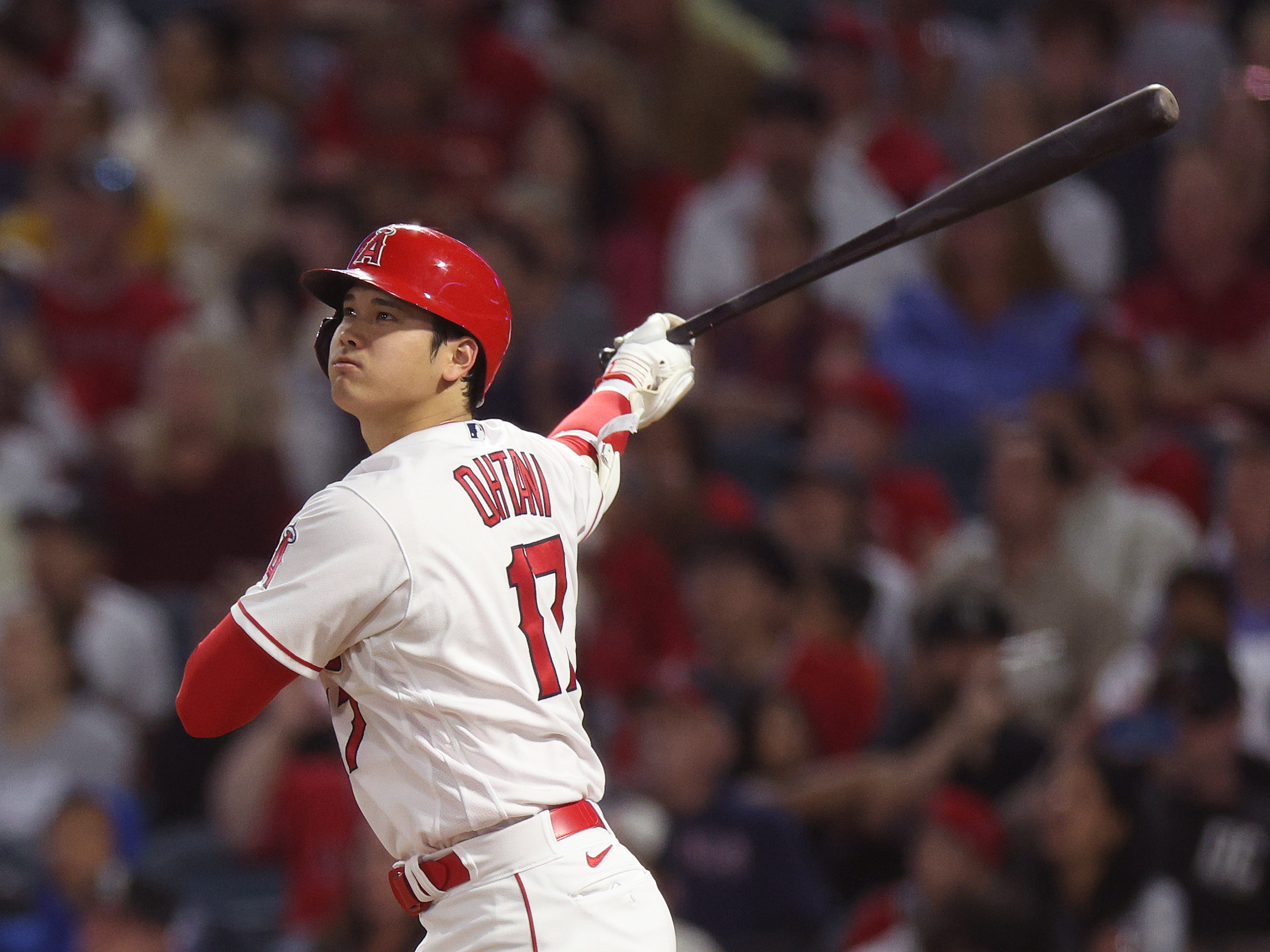 Shohei Ohtani #17 of the Los Angeles Angels watches his opposite field solo homerun, to take a 3-1 lead over the Chicago White Sox, during the seventh inning at Angel Stadium of Anaheim on June 27, 2023 in Anaheim, California.
