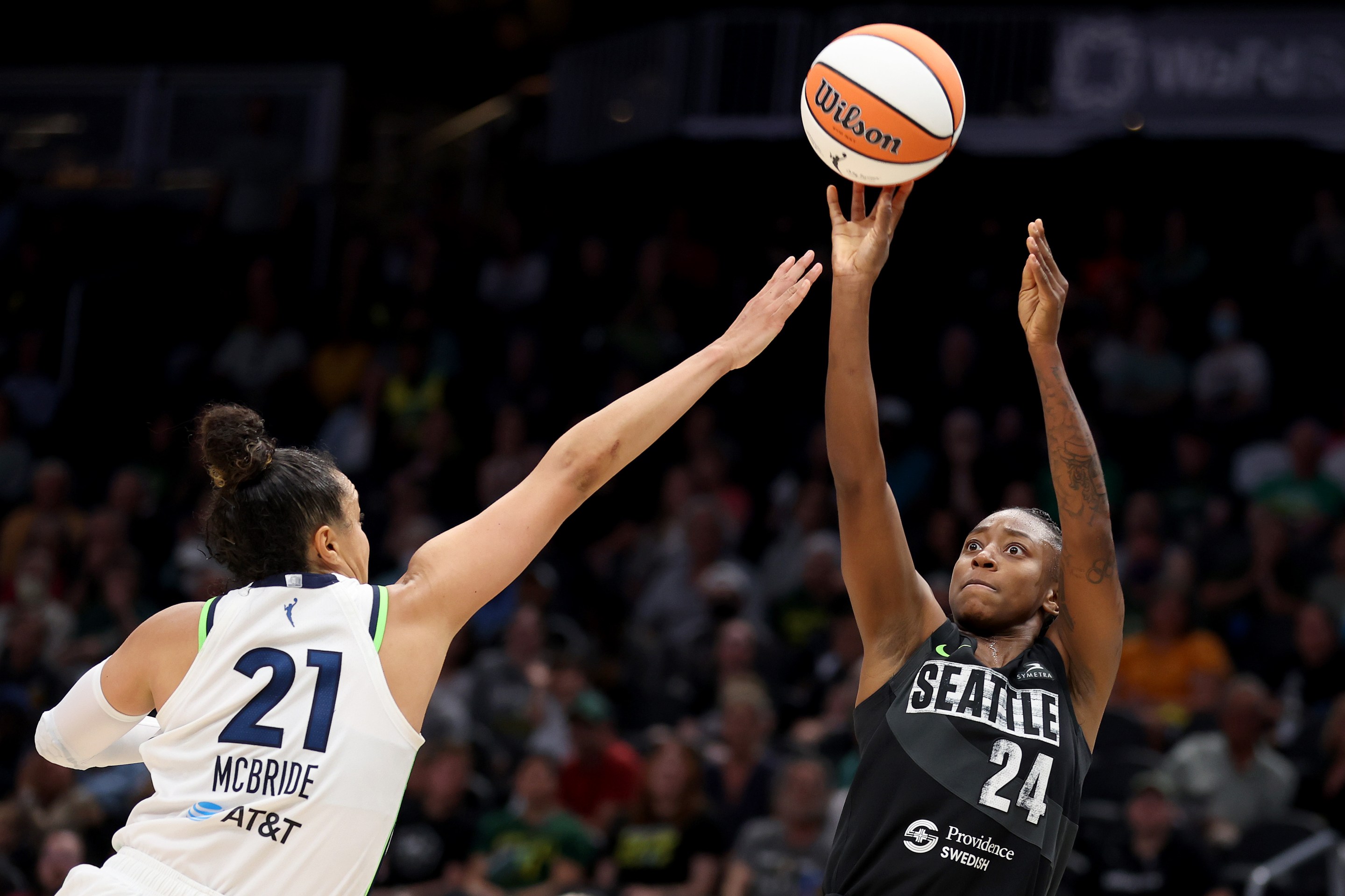 Jewell Loyd #24 of the Seattle Storm shoots against Kayla McBride #21 of the Minnesota Lynx in overtime at Climate Pledge Arena on June 29, 2023 in Seattle, Washington.