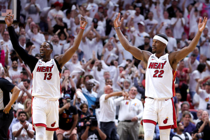 Jimmy Butler and Bam Adebayo of the Miami Heat pump up the home crowd