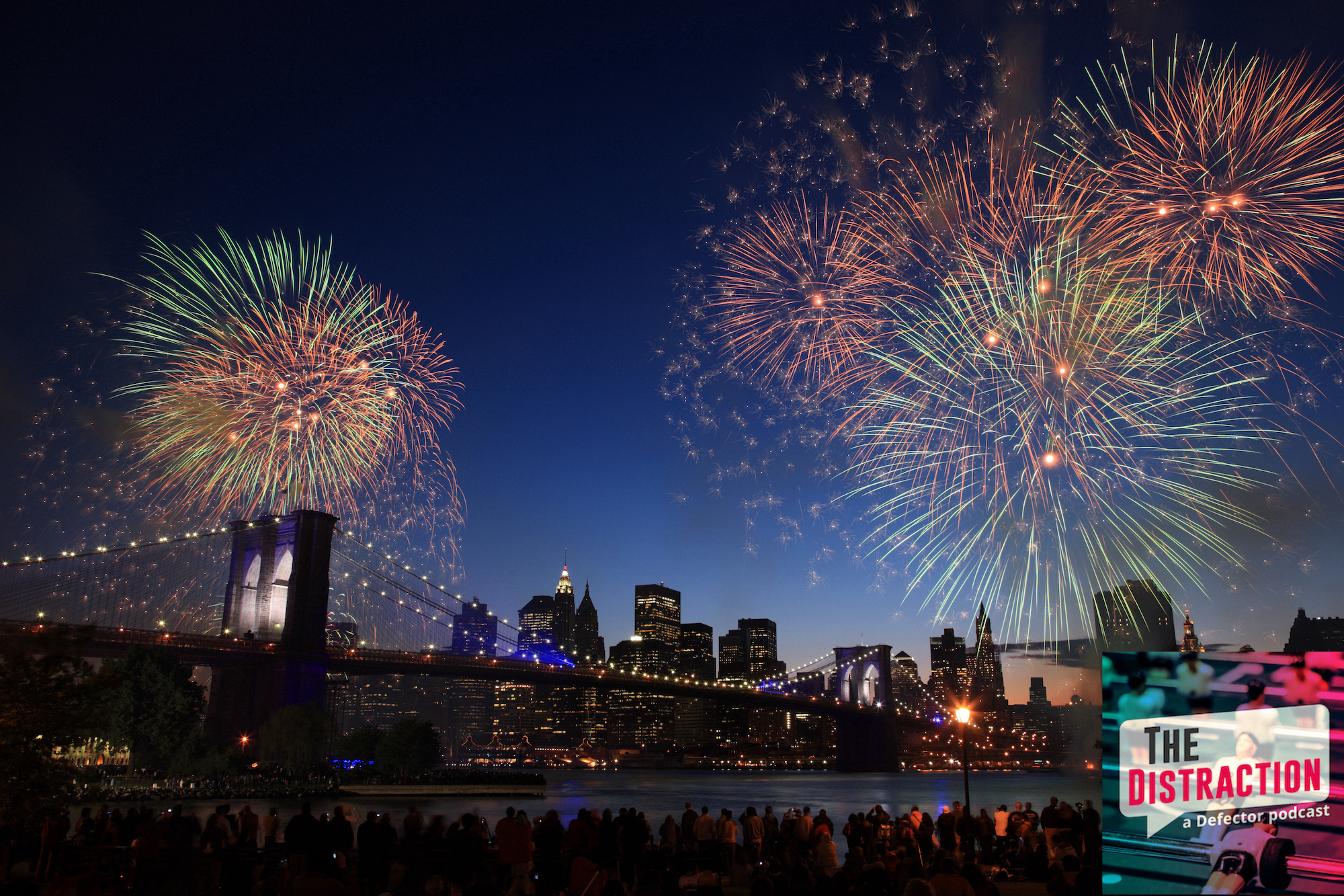 A photo of people watching fireworks over the Brooklyn Bridge and lower Manhattan.