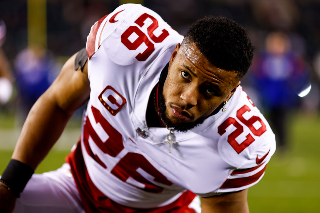 Saquon Barkley #26 of the New York Giants stretches prior to an NFL divisional round football game against the Philadelphia Eagles at Lincoln Financial Field on January 21, 2023 in Philadelphia, Pennsylvania.