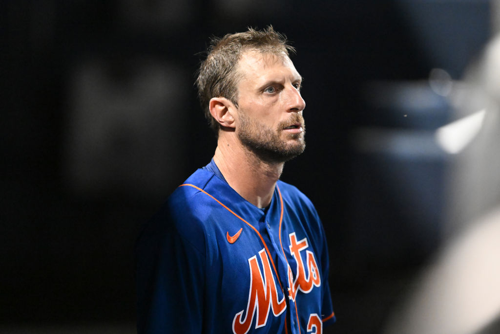 Max Scherzer #21 of the New York Mets looks on during the fifth inning of a spring training game against the Houston Astros at The Ballpark of the Palm Beaches on March 18, 2023 in West Palm Beach, Florida.