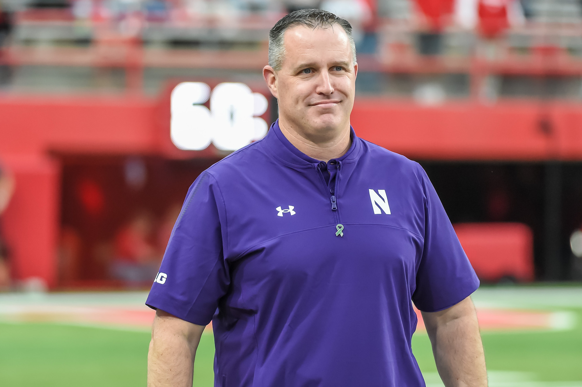 LINCOLN, NE - OCTOBER 2: Head coach Pat Fitzgerald of the Northwestern Wildcats watches the team warm up before the game against the Nebraska Cornhuskers at Memorial Stadium on October 2, 2021 in Lincoln, Nebraska. (Photo by Steven Branscombe/Getty Images)