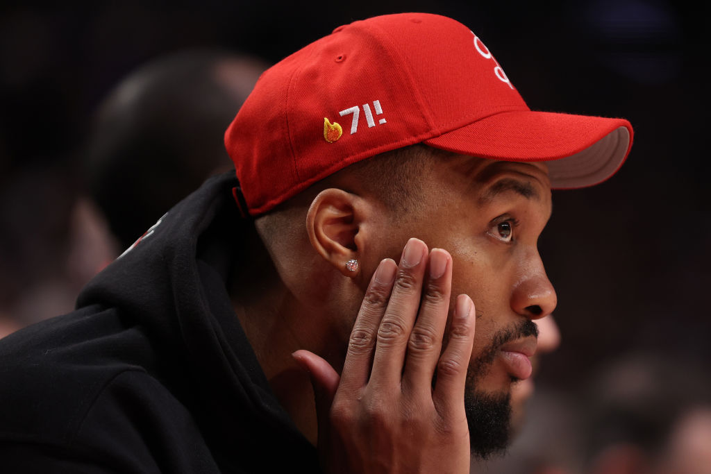 Damian Lillard #0 of the Portland Trail Blazers looks on during the third quarter against the Golden State Warriors at Moda Center on April 09, 2023 in Portland, Oregon