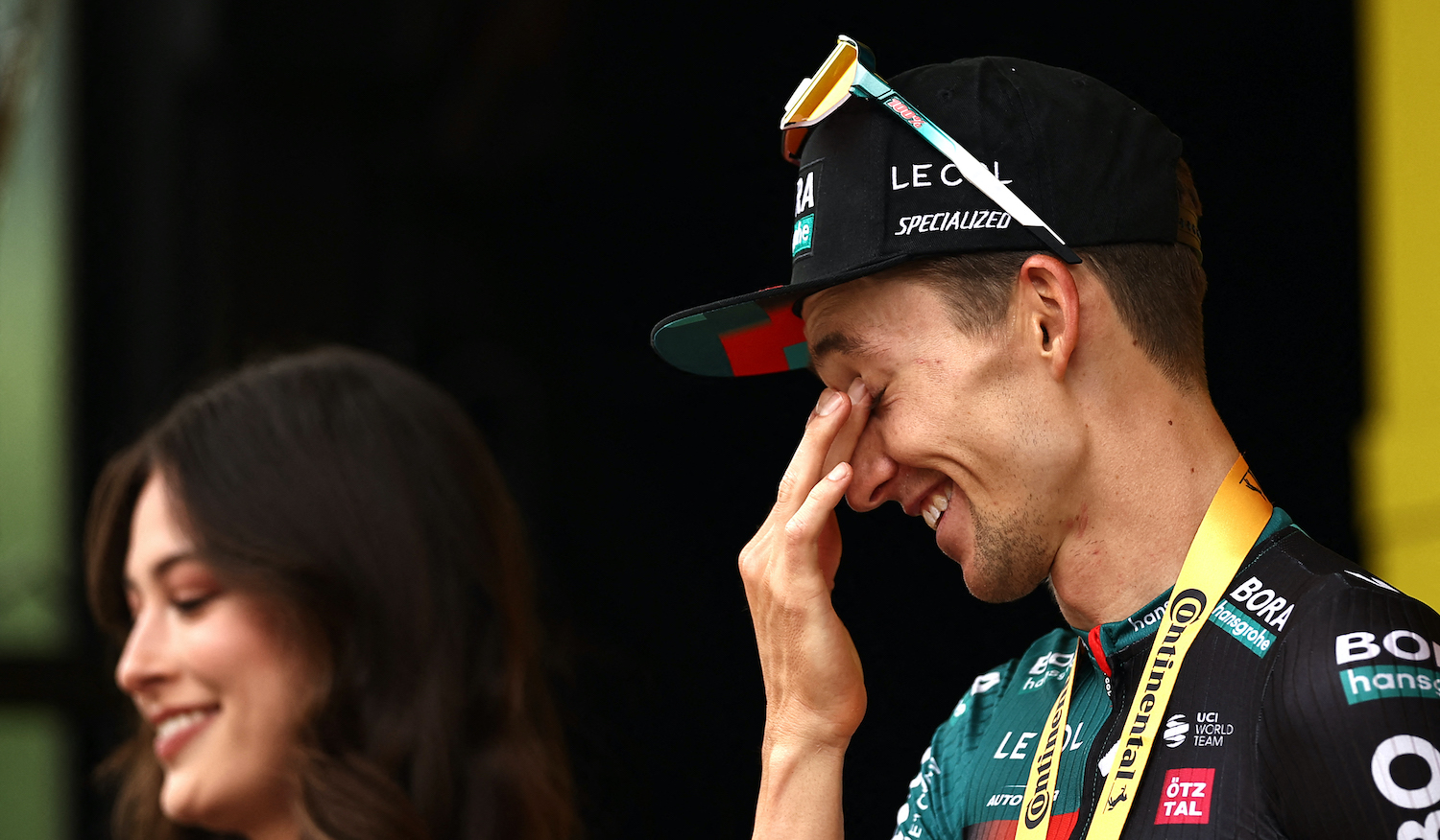 BORA - hansgrohe's Australian rider Jai Hindley celebrates on the podium after winning the 5th stage of the 110th edition of the Tour de France cycling race, 163 km between Pau and Laruns, in the Pyrenees mountains in southwestern France, on July 5, 2023. (Photo by Anne-Christine POUJOULAT / AFP) (Photo by ANNE-CHRISTINE POUJOULAT/AFP via Getty Images)