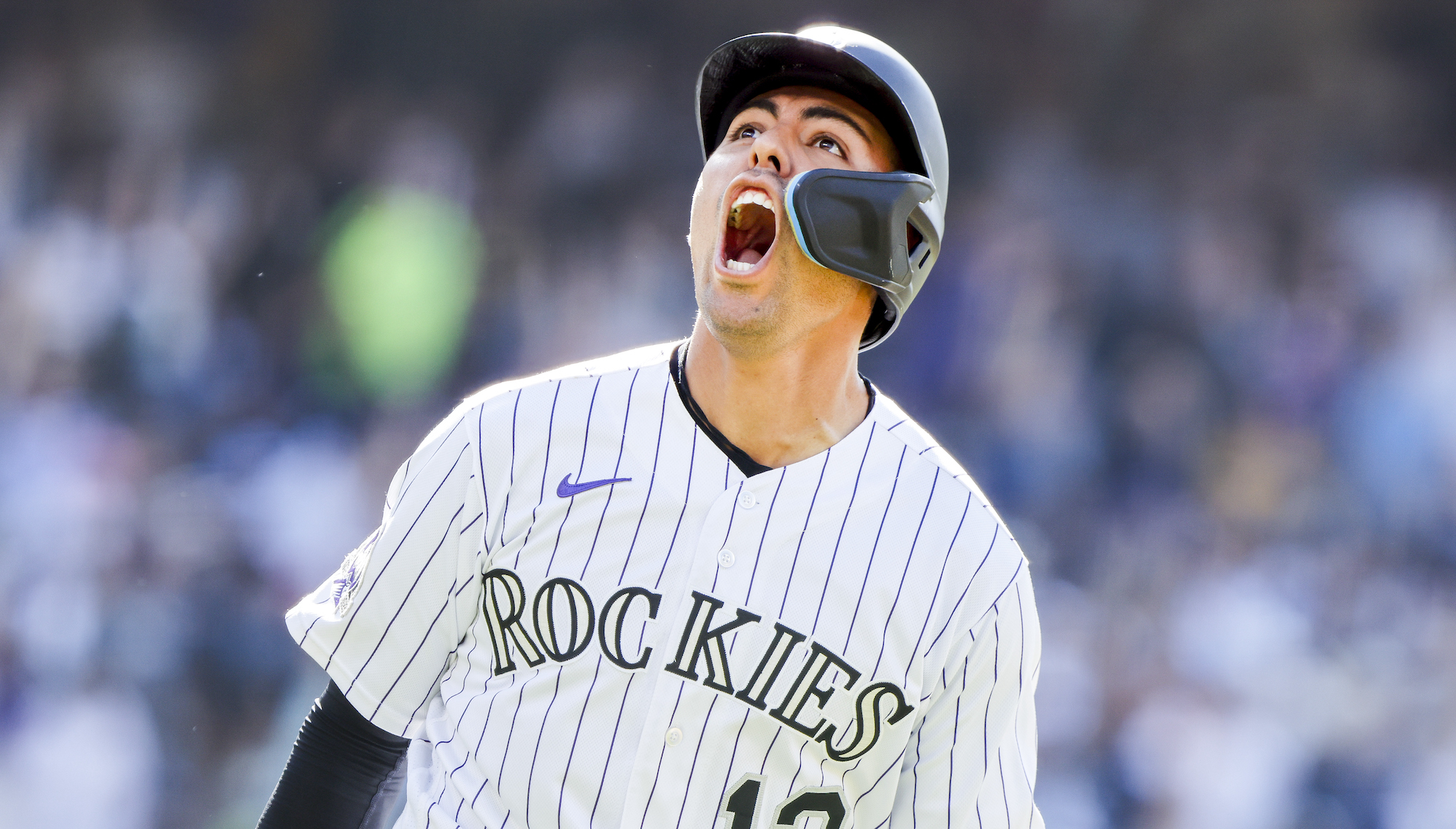 DENVER, CO - JULY 16: Alan Trejo #13 of the Colorado Rockies celebrates after hitting a walk-off home run to beat the New York Yankees in the eleventh inning at Coors Field on July 16, 2023 in Denver, Colorado. (Photo by Michael Ciaglo/Getty Images) *** Local Caption *** Alan Trejo