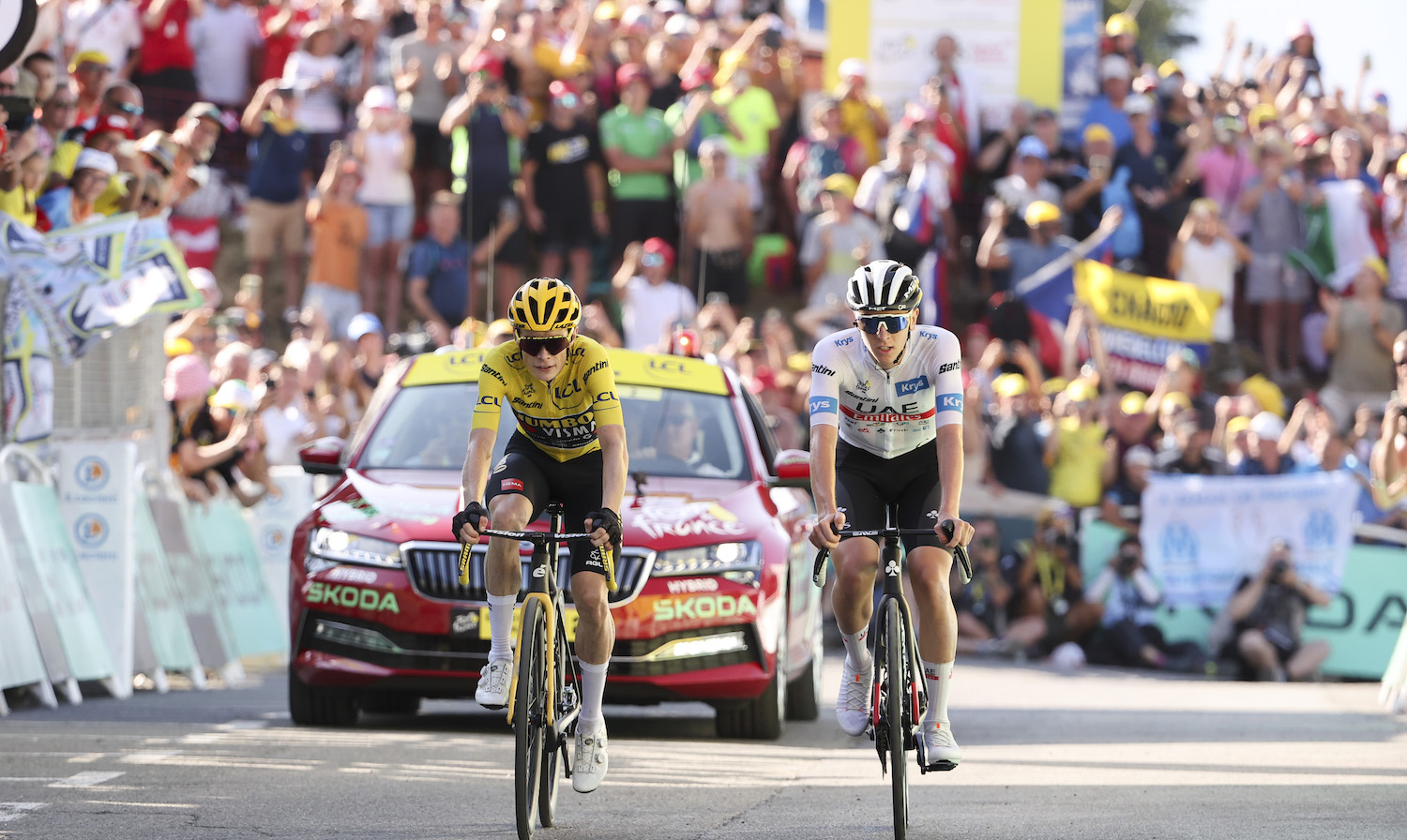 SAINT-GERVAIS MONT-BLANC, FRANCE - JULY 16: Yellow jersey, race leader Jonas Vingegaard of Denmark and Jumbo - Visma and White jersey of best young rider Tadej Pogacar of Slovenia and UAE Team Emirates cross the finish line of stage fifteen of the 110th Tour de France 2023, a 179km stage from Les Gets les Portes du Soleil to Saint-Gervais Mont-Blanc 1379m / #UCIWT / on July 16, 2023 in Saint-Gervais Mont-Blanc, France. (Photo by Jean Catuffe/Getty Images)