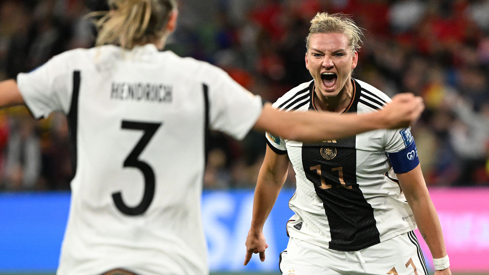 Germany's forward #11 Alexandra Popp (R) celebrates scoring her team's first goal during the Australia and New Zealand 2023 Women's World Cup Group H football match between Germany and Morocco at Melbourne Rectangular Stadium, also known as AAMI Park, in Melbourne on July 24, 2023.