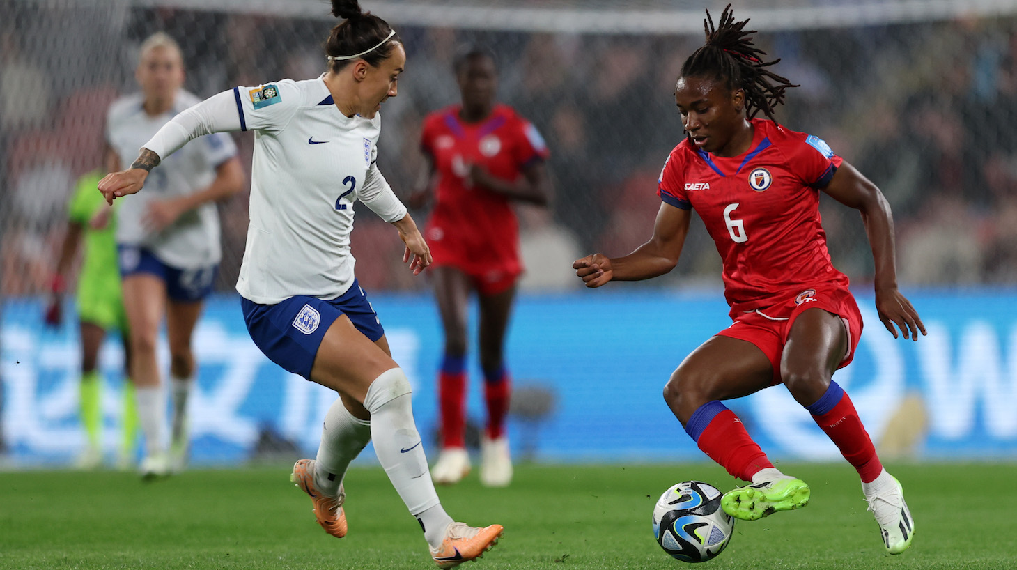 Lucy Bronze of England battles for possession with Melchie Dumornay of Haiti during the FIFA Women's World Cup Australia &amp; New Zealand 2023 Group D match between England and Haiti at Brisbane Stadium on July 22, 2023 in Brisbane / Meaanjin, Australia.