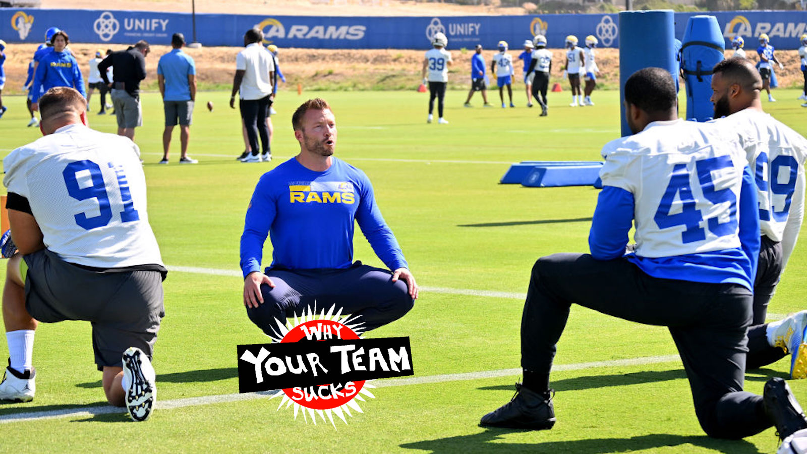 Head coach Sean McVay of the Los Angeles Rams talks with Greg Gaines #91, Bobby Wagner #45 and Aaron Donald #99 as they stretch before mini camp on June 8, 2022 at the team's facility at California Lutheran University in Thousand Oaks, California.