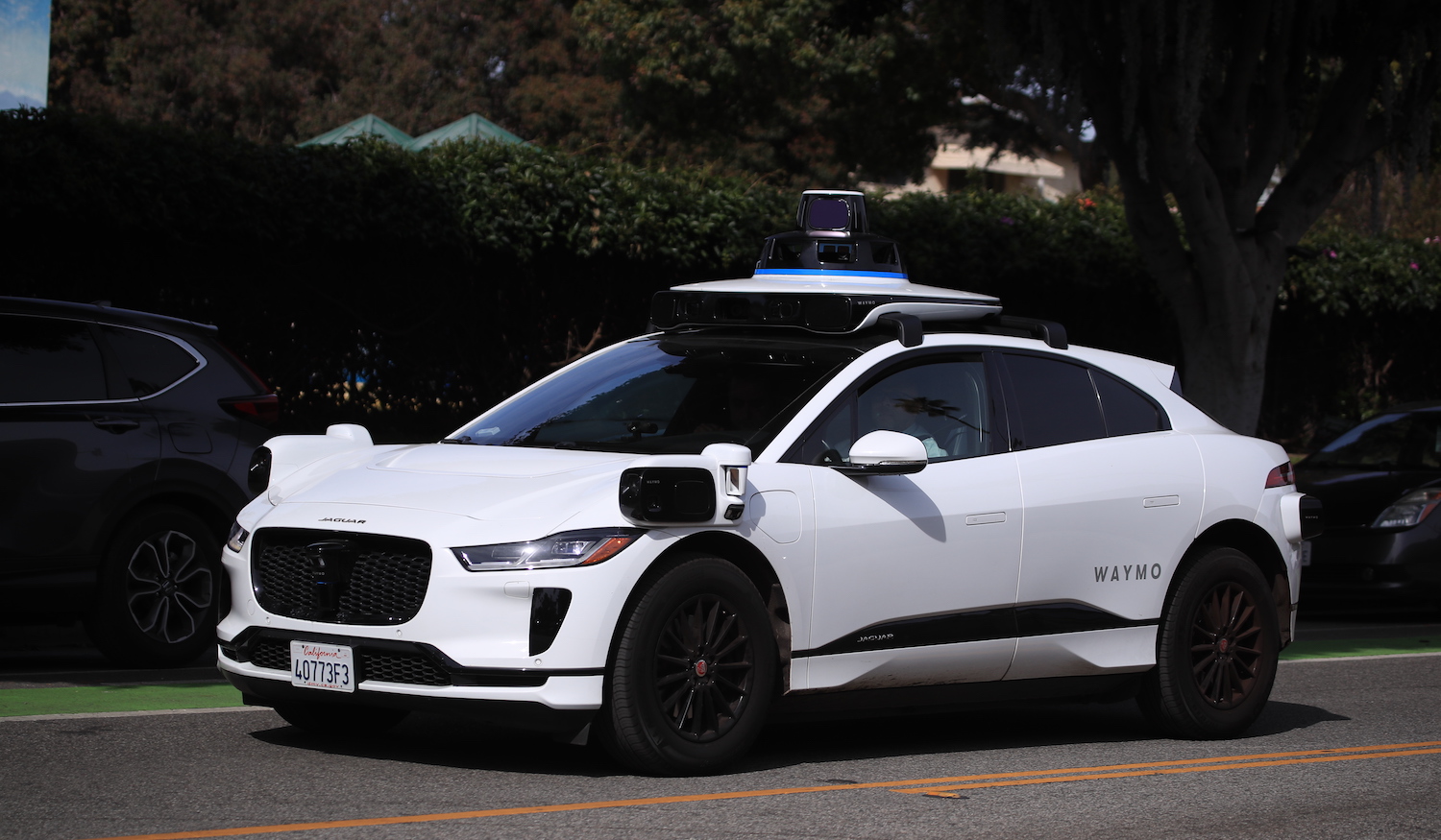 Santa Monica, CA - February 21: Passengers ride in an electric Jaguar I-Pace car outfitted with Waymo full self-driving technology in Santa Monica Tuesday, Feb. 21, 2023. (Allen J. Schaben / Los Angeles Times via Getty Images)